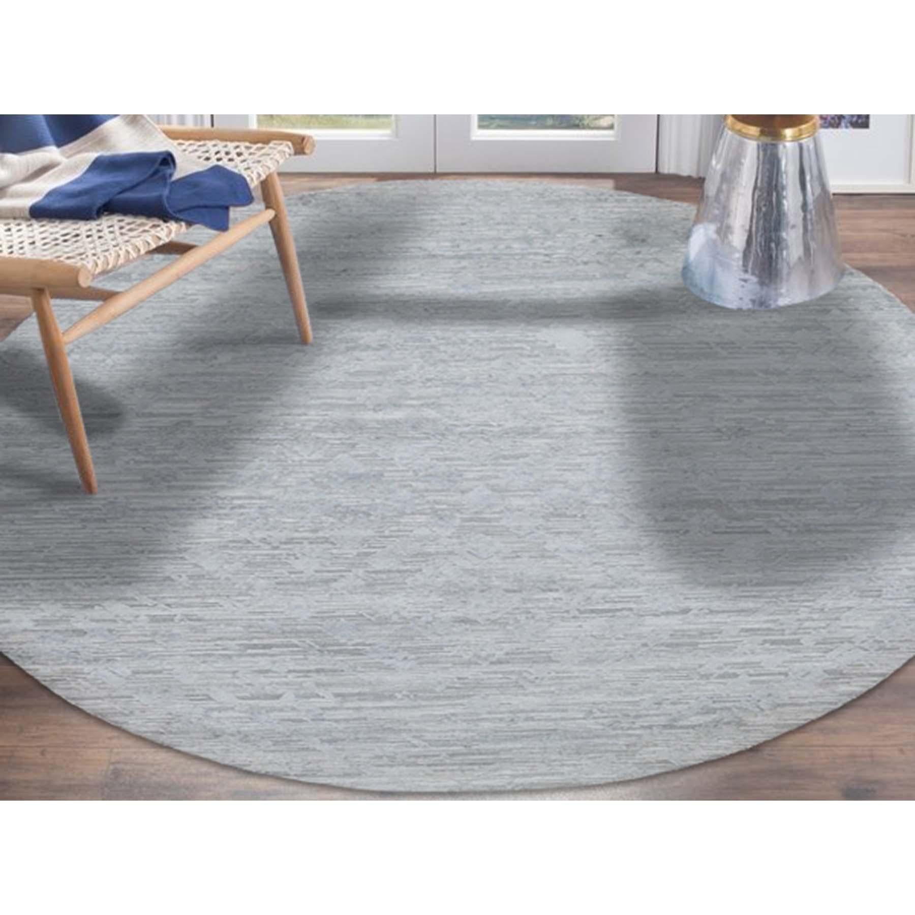 This is a truly genuine one-of-a-kind silver round hand spun undyed natural wool modern hand-knotted rug. It has been knotted for months and months in the centuries-old Persian weaving craftsmanship techniques by expert artisans. Measures: 10'0