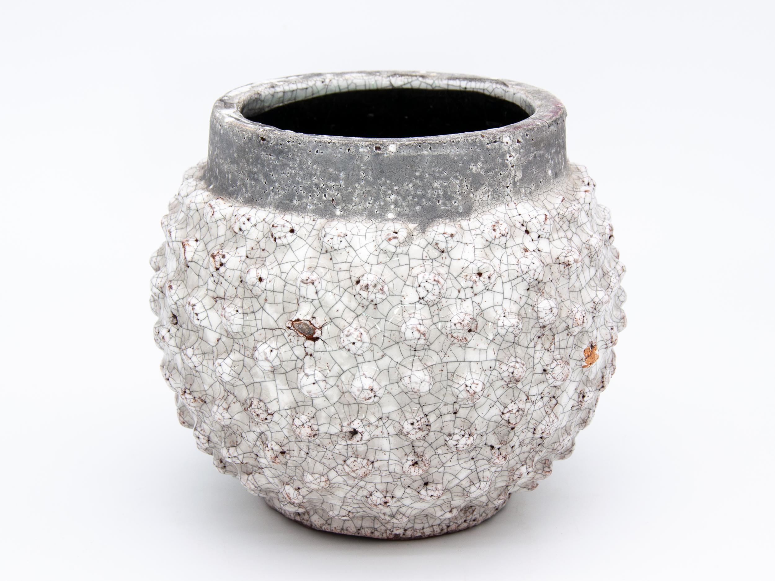 Round hobnail planter in white glaze with crackle finish.