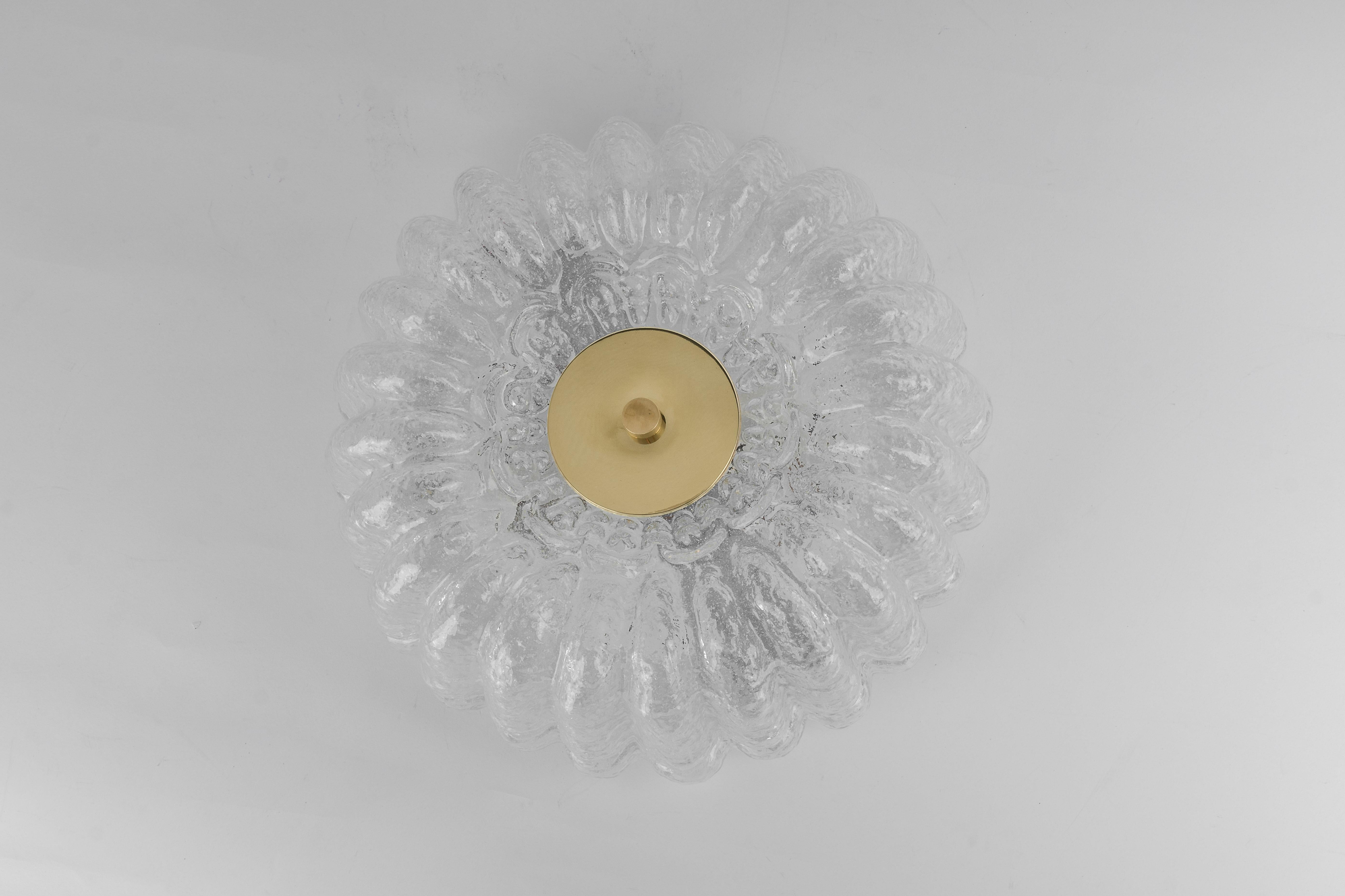 A wonderful round ice glass flush mount by Limburg, Germany, 1970s.
Thick textured Murano fixtured on a gold metal base.

High quality and in very good condition. Cleaned, well-wired, and ready to use. 

Each fixture requires 2 x E27 standard bulbs