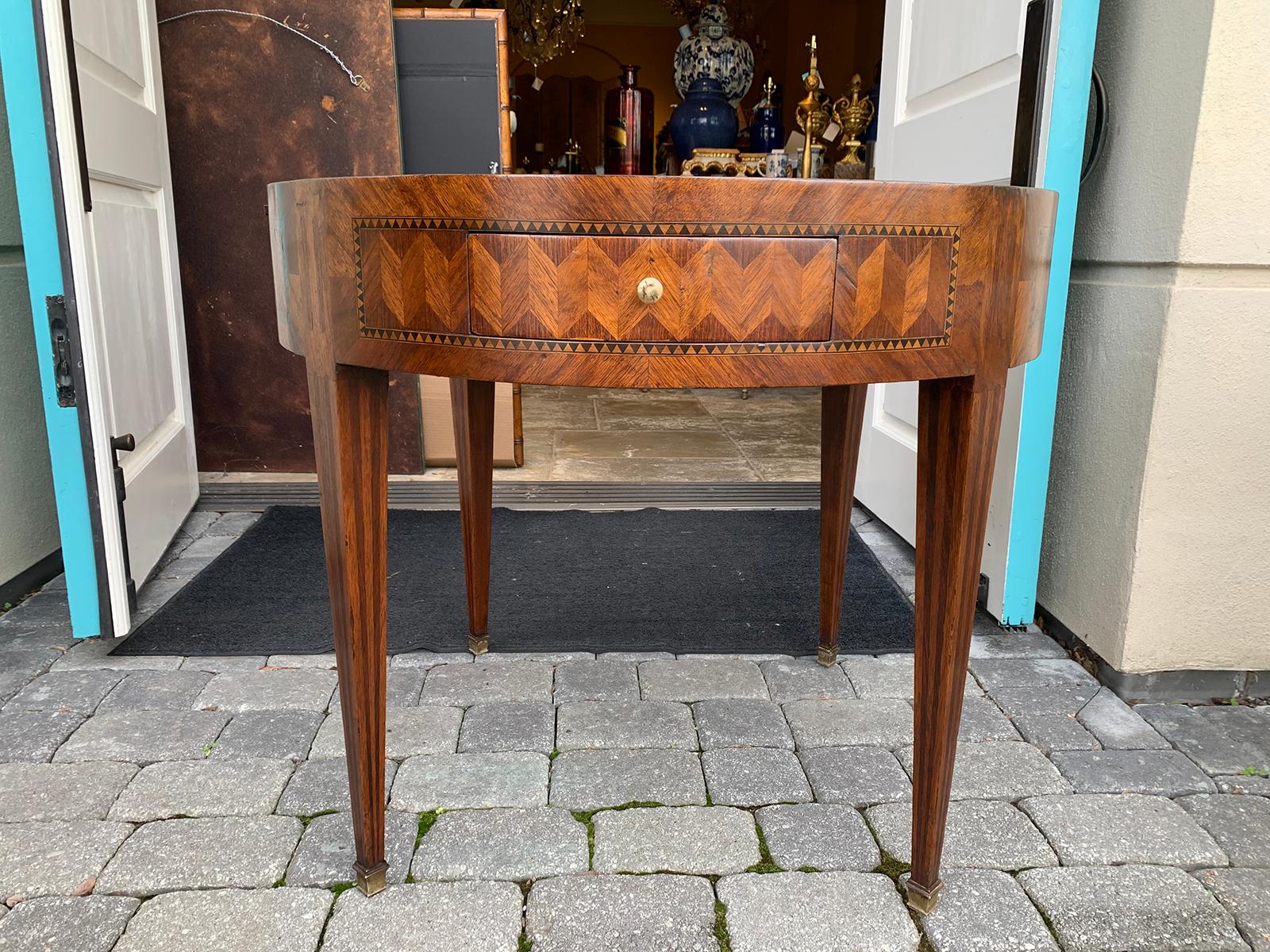 Round inlaid table circa 1880s-1920s, possibly Italian
Two drawers and two slides
Inlay of kingswood, rosewood, boxwood, and ebony
beautiful craftsmanship.