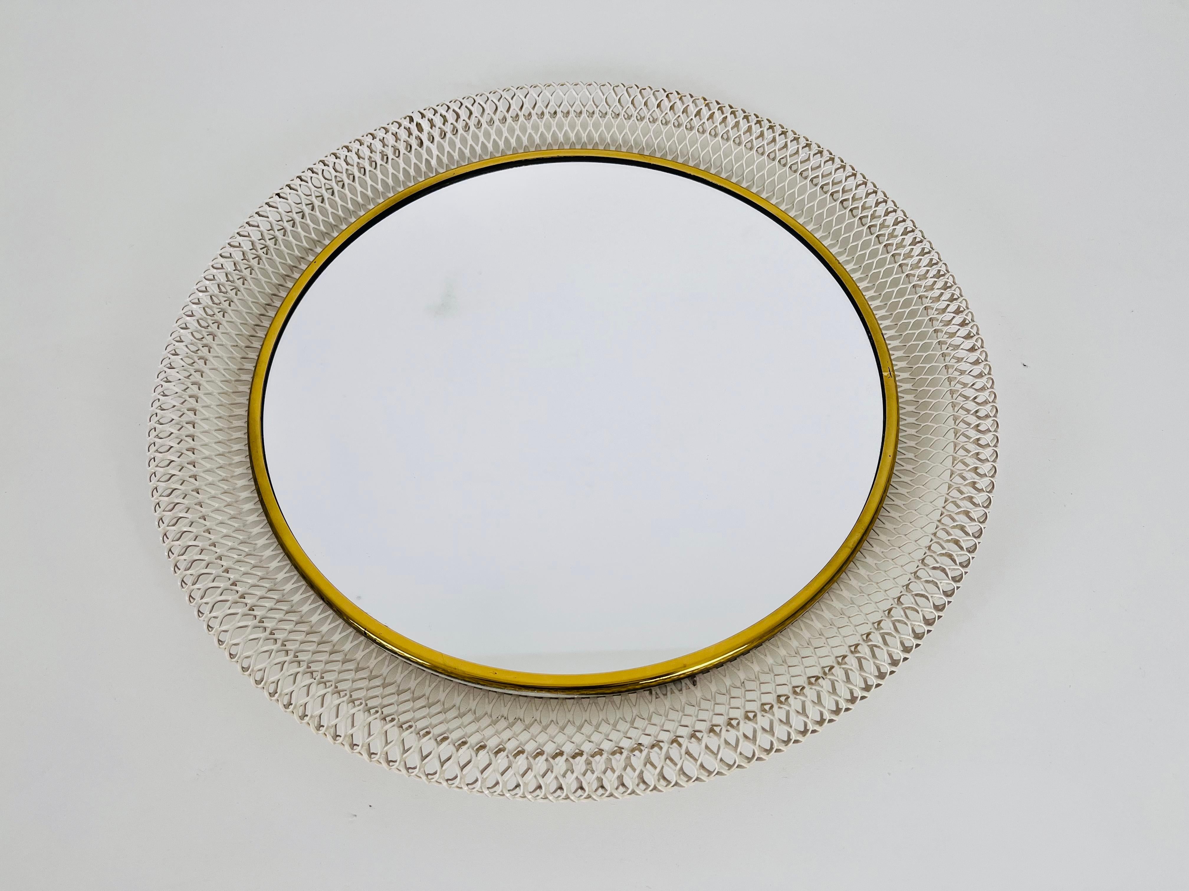An Italian brass framed wall mirror. Beautiful with its amazing design.

Very good vintage condition. Free worldwide expedited shipping.