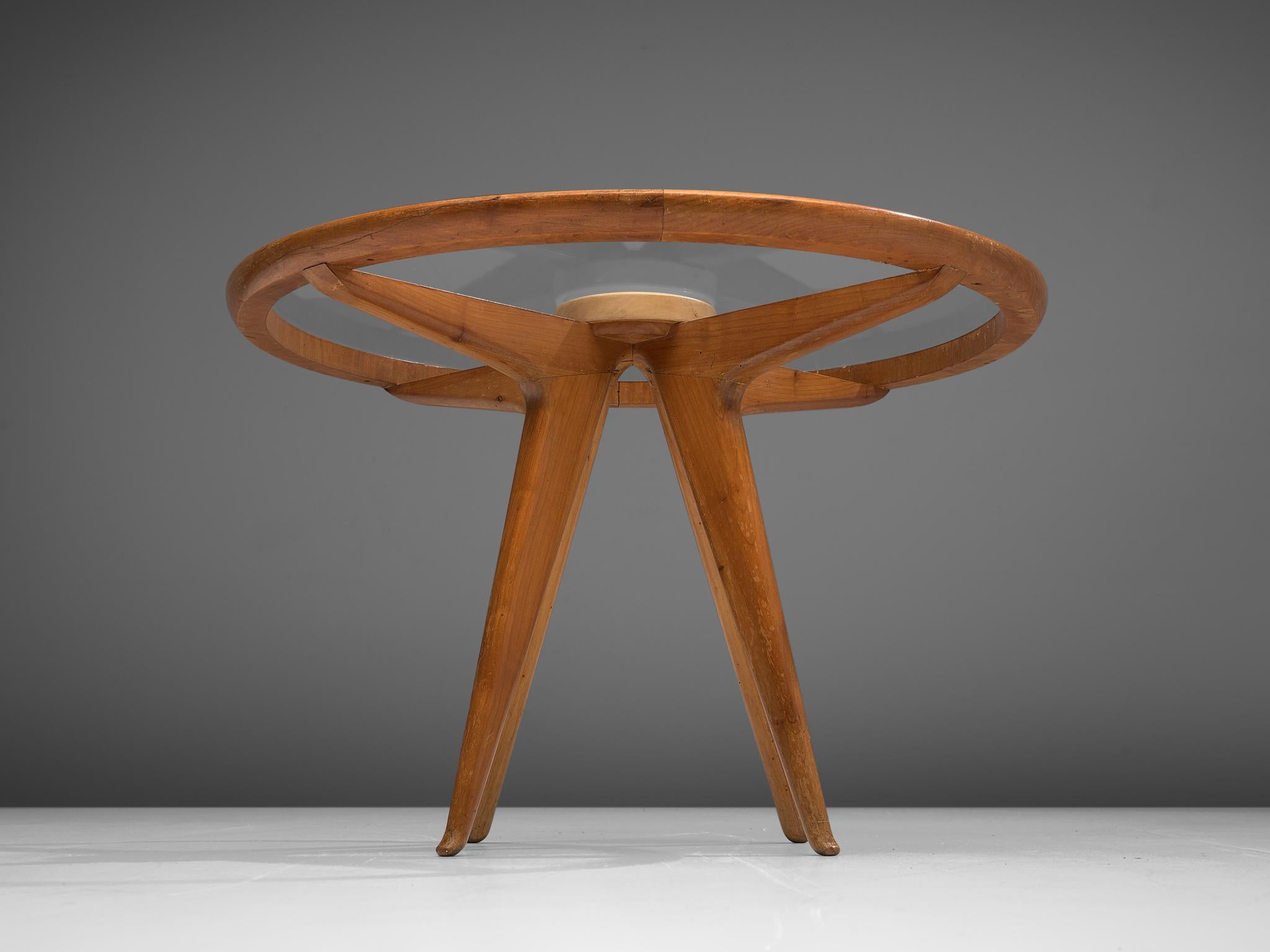 Coffee table, Italian walnut, glass, Italy, 1960s

Round coffee table with glass table top, manufactured in Italian walnut. This coffee table has a beautiful open structure due to the glass table top. This way the construction of the legs,
