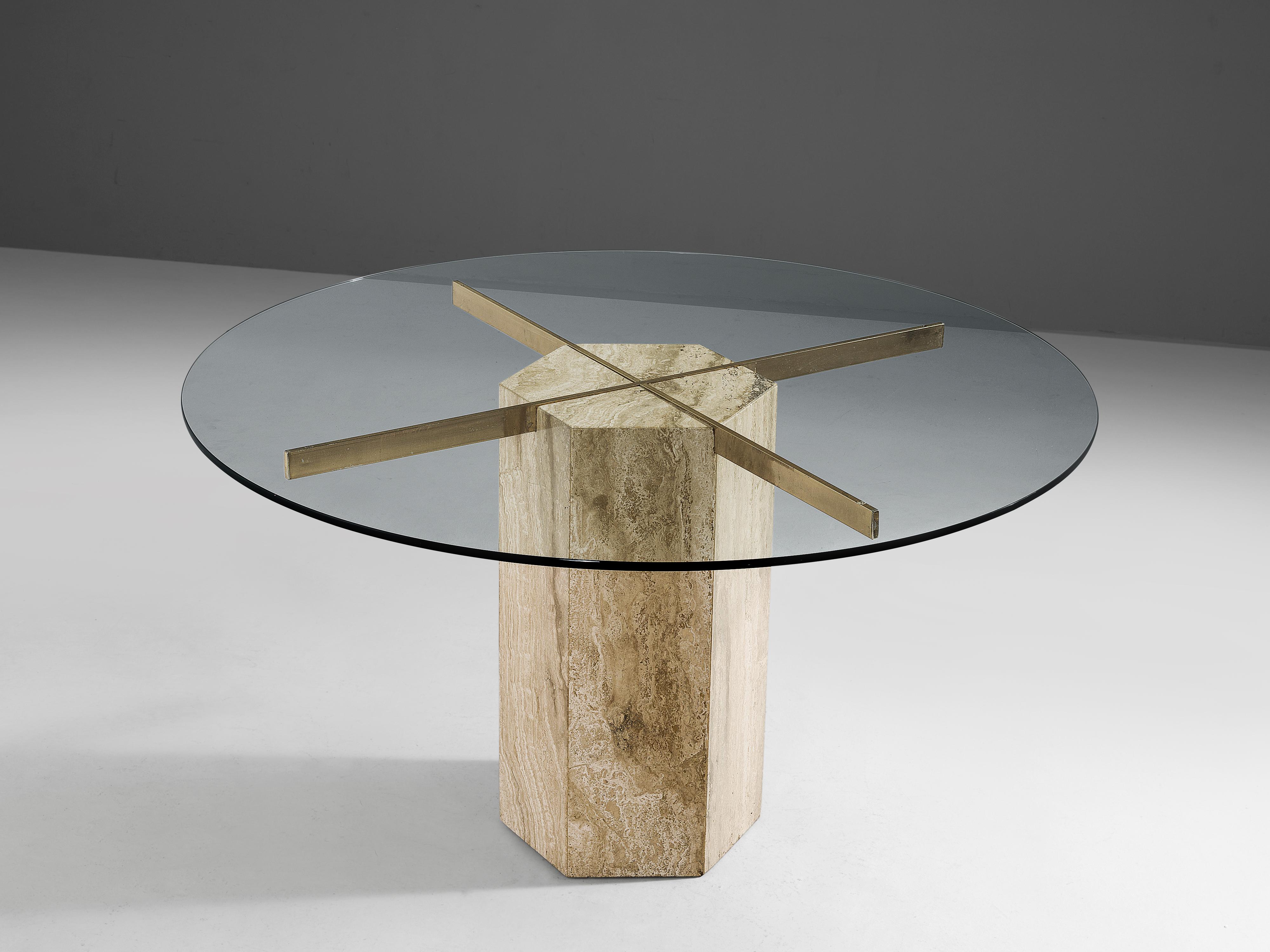 Dining table, travertine, glass, brass, Italy, 1970s

Luxurious Italian dining table with a polygonal pedestal base in travertine. Inlayed in the travertine base is a large brass cross that supports the round glass top. Due the clear glass, the