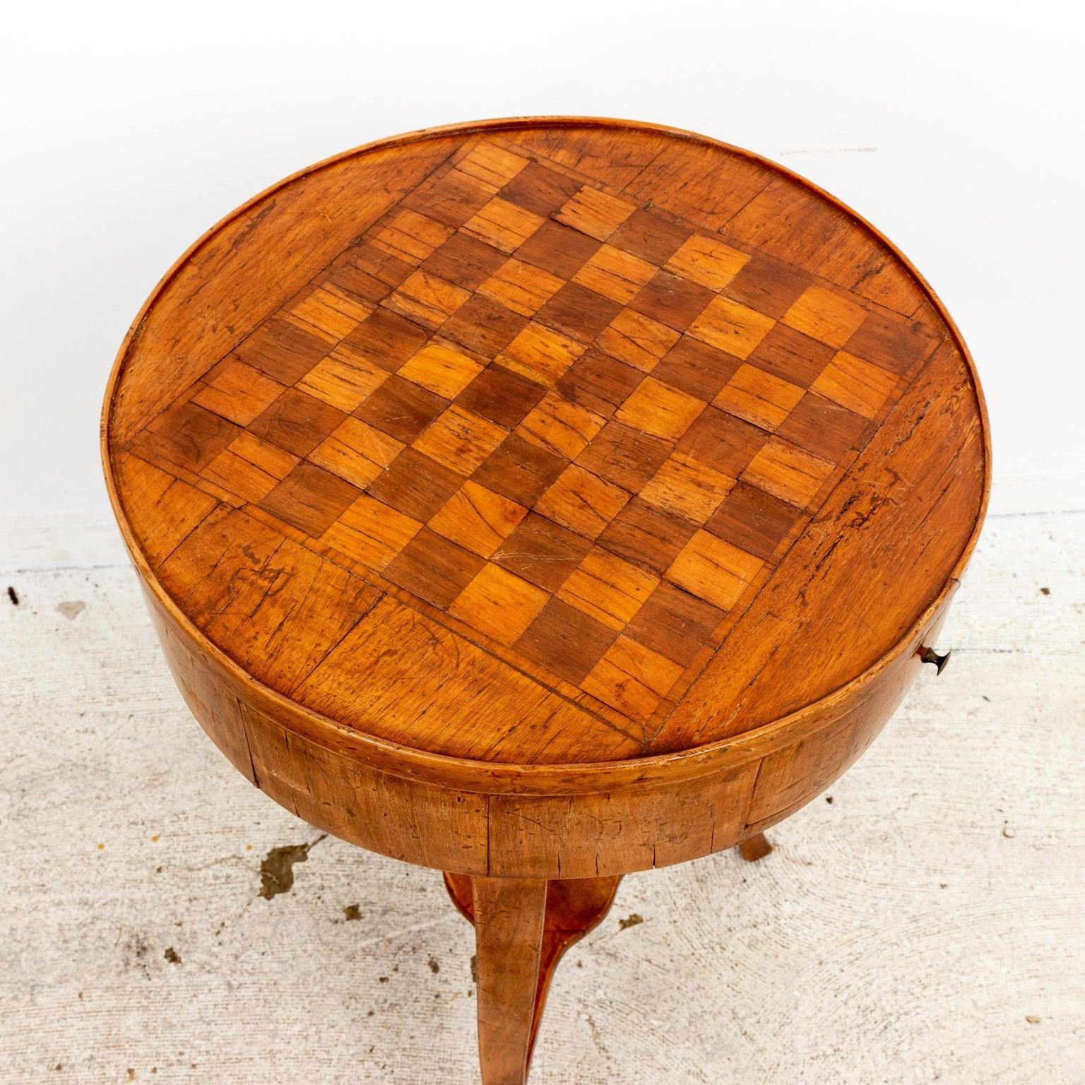Round Italian game table, with one drawer resting on three square tapered legs. Wear consistent with age.