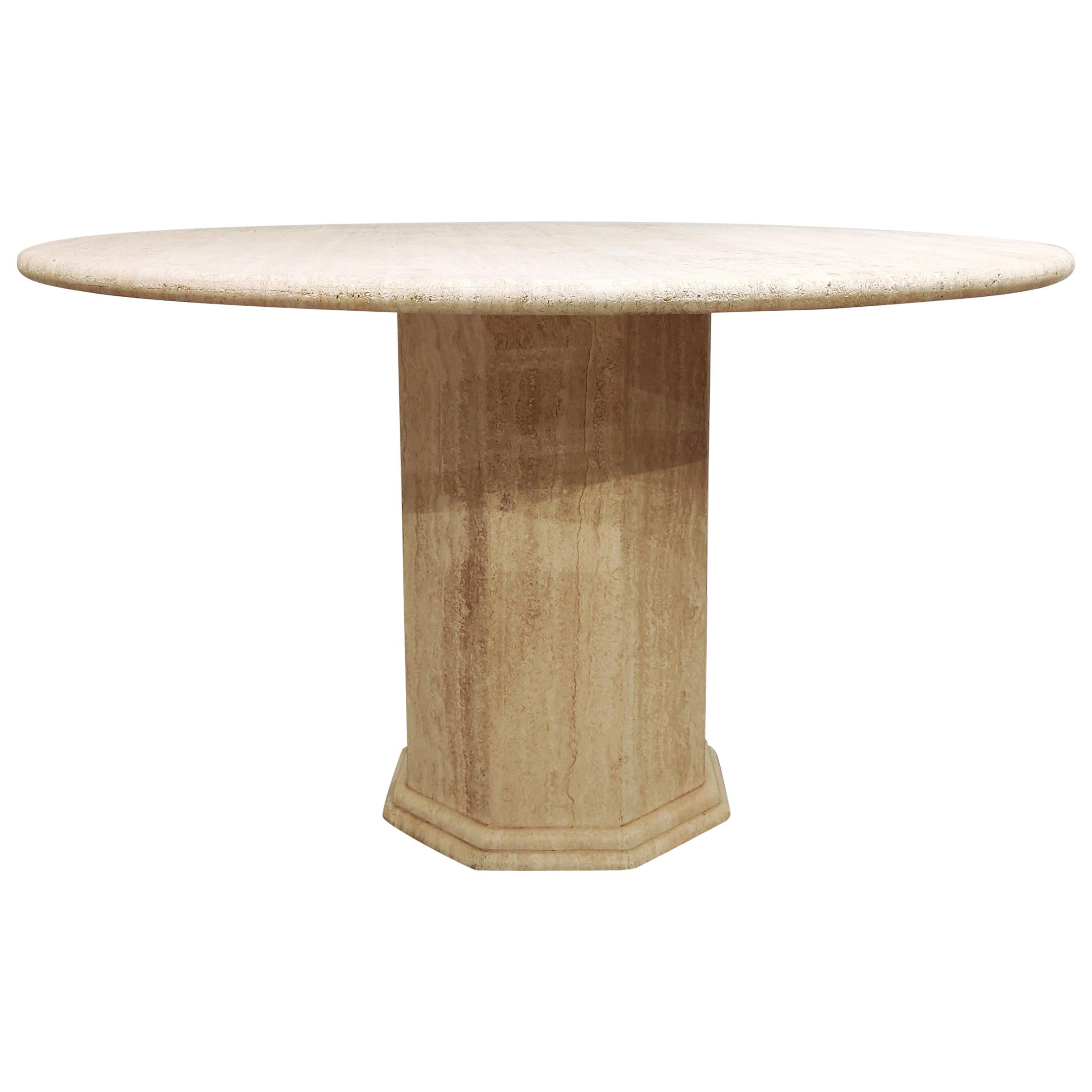 Beautiful dining table made from travertine stone.

Beautiful travertine material with the natural 'holes' in the stone.

Nicely finished round top.

Good condition

1970s - Italy

Measures: Height 74cm/29.13