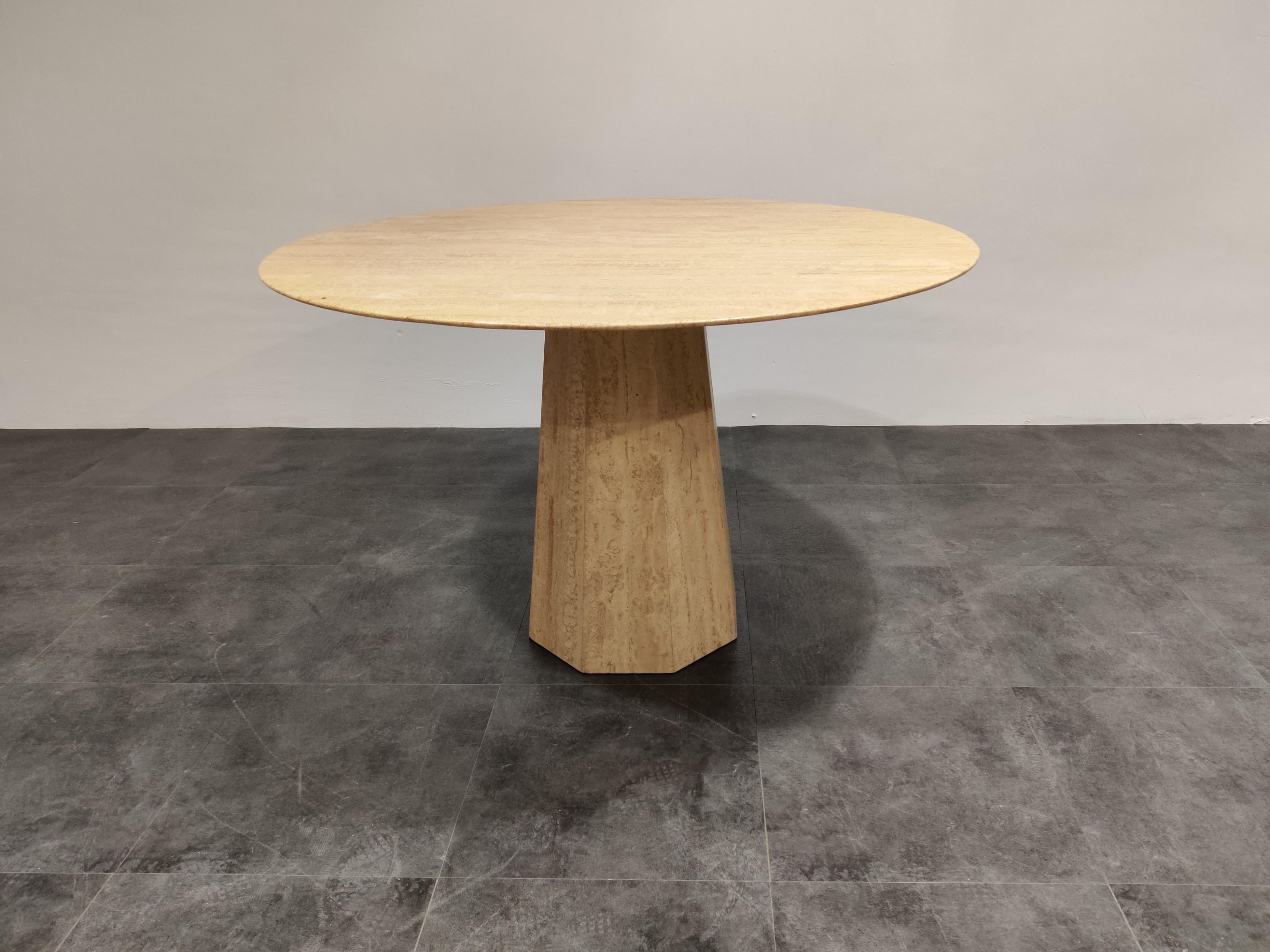Beautiful octagonal conical base dining or center table made from travertine stone.

The table has a beautiful base supporting a round finely finished top.

Good condition

1970s, Italy

Measures: Height 72cm/28.34