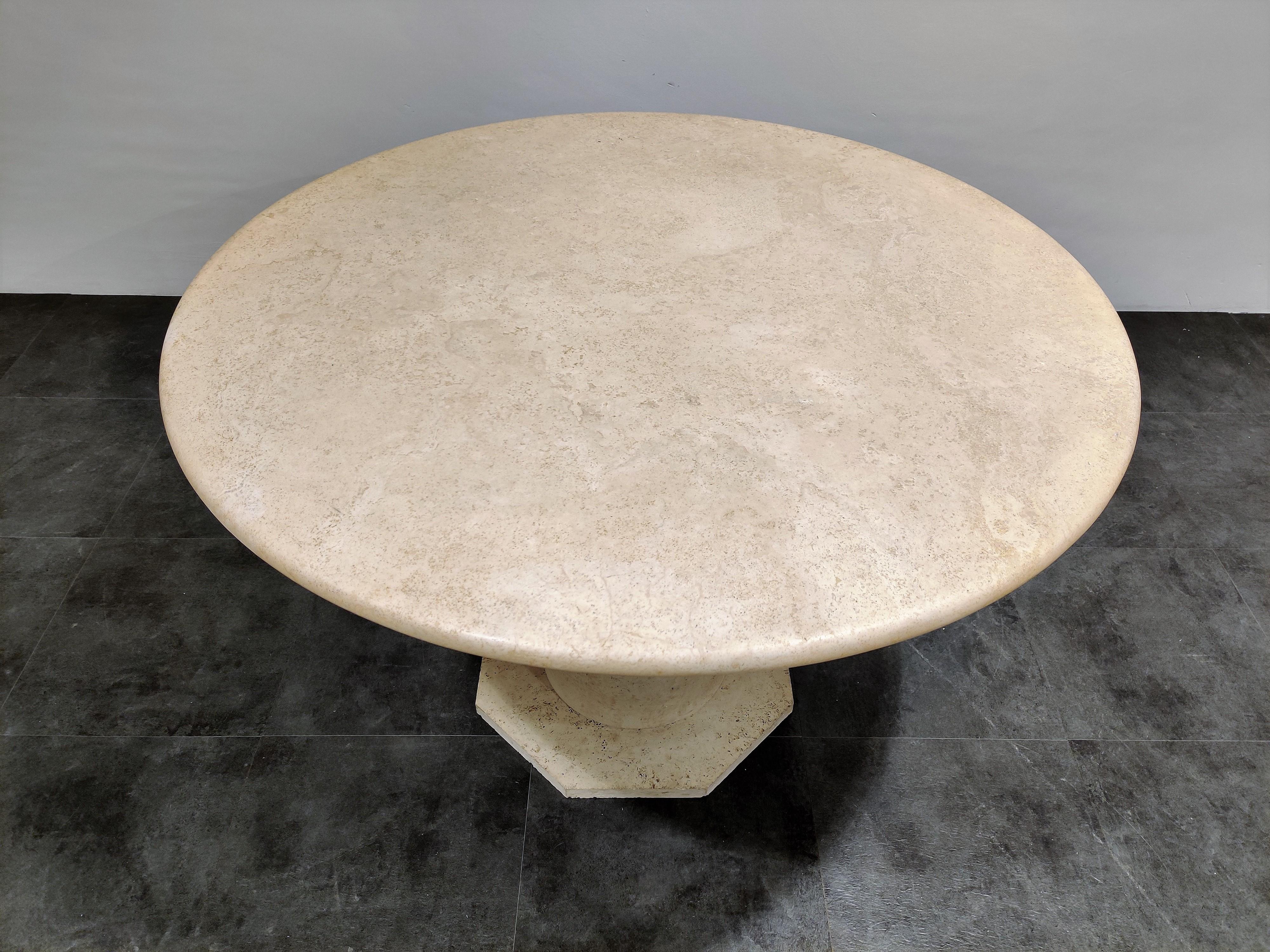 Beautiful dining or center table made from travertine stone.

The table has a beautiful octagonal base supporting a round finely finished top.

Good condition

1970s, Italy

Measures: Height 78cm/30.70