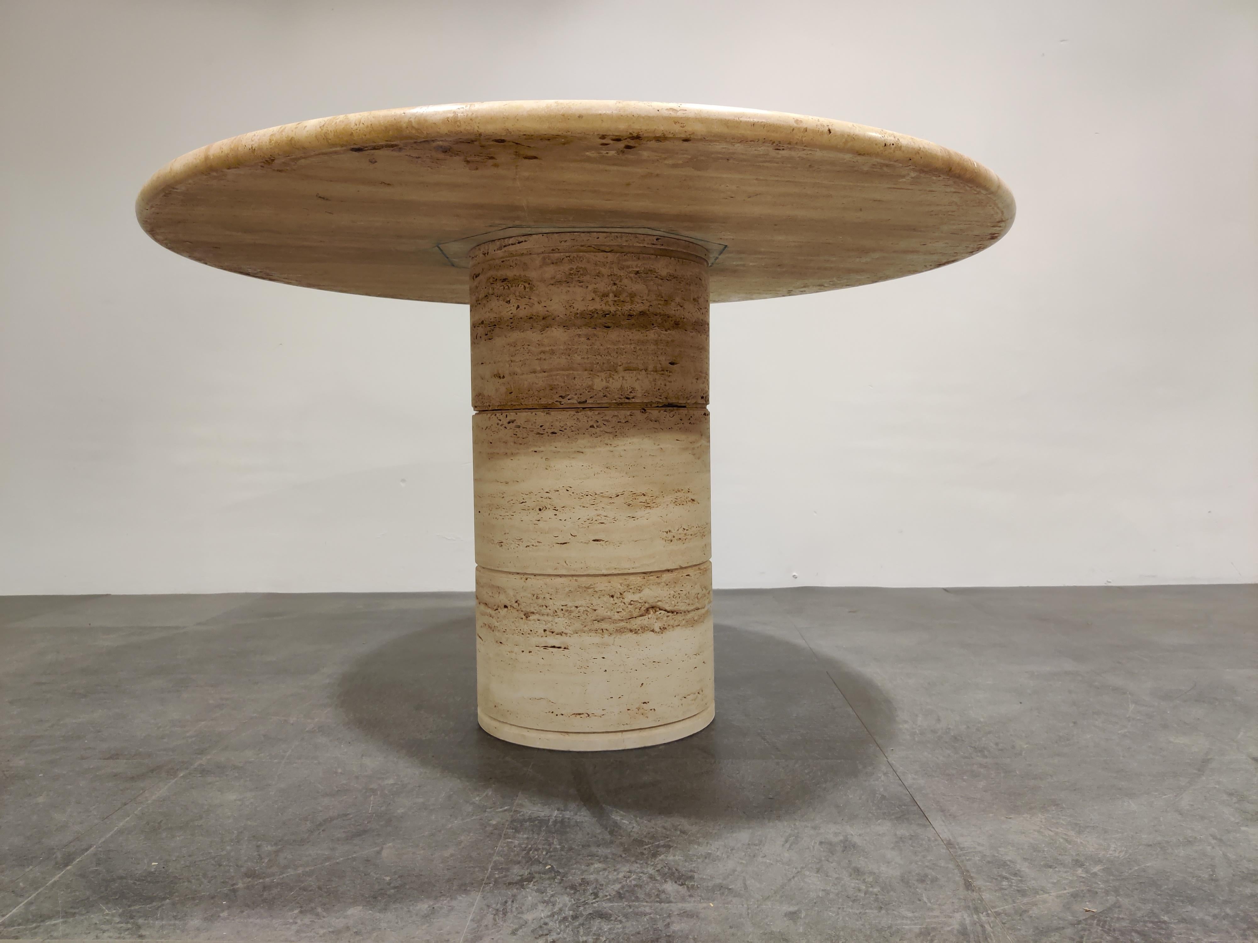 Beautiful pedestal base dining table made from travertine stone.

The table has a beautiful base with the natural 'holes' in the stone.

Beautiful rounded top.

Good condition

1970s, Italy

Measures: Height 74cm/29.13