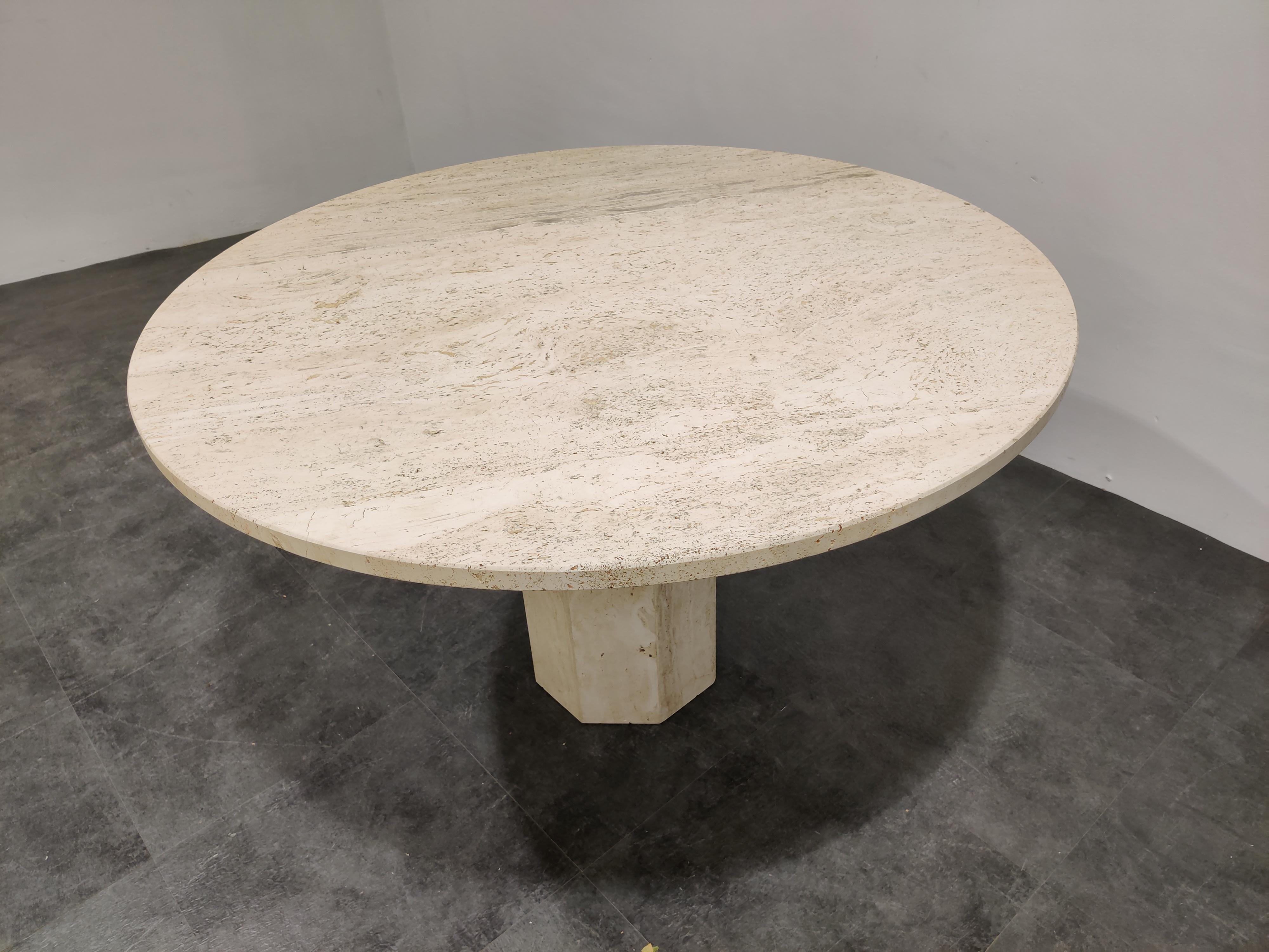 Beautiful dining table made from travertine stone.

Gorgeous travertine stone color.

Lovely round top resting on a octogonal pedestal base.

Good condition

1970s - Italy

Measures: Height 74cm/29.13