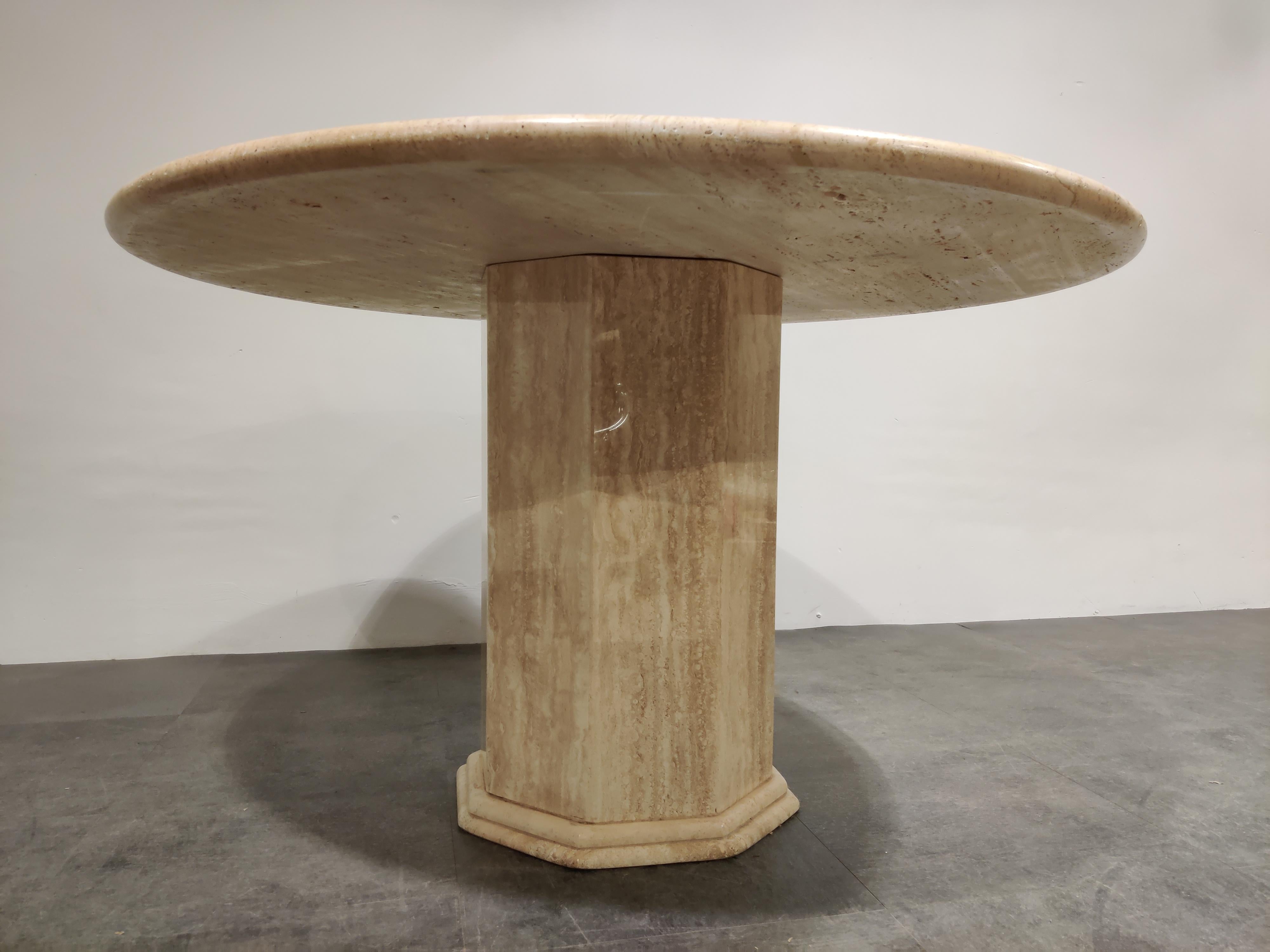 Beautiful dining table made from travertine stone.

Beautiful travertine material with the natural 'holes' in the stone.

Nicely finished round top.

Good condition

1970s, Italy

Measures: Height 74cm/29.13