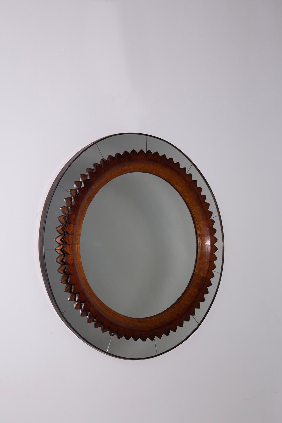 Behold a masterpiece of 1950s Italian craftsmanship by Fratelli Marelli: a stunning round mirror, encased in the warm embrace of walnut wood. This exquisite piece stands as a testament to the era's unparalleled attention to detail and the enduring