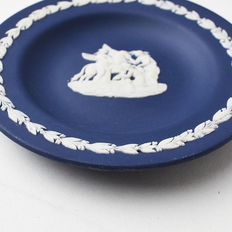 A fabulous collectible English jewelry dish with a Greek Mythological design. This piece is by Wedgwood and is in a deep navy blue. This color is harder to find by Wedgwood. It’s counterpart, known as “Wedgwood Blue” is more common to find unlike