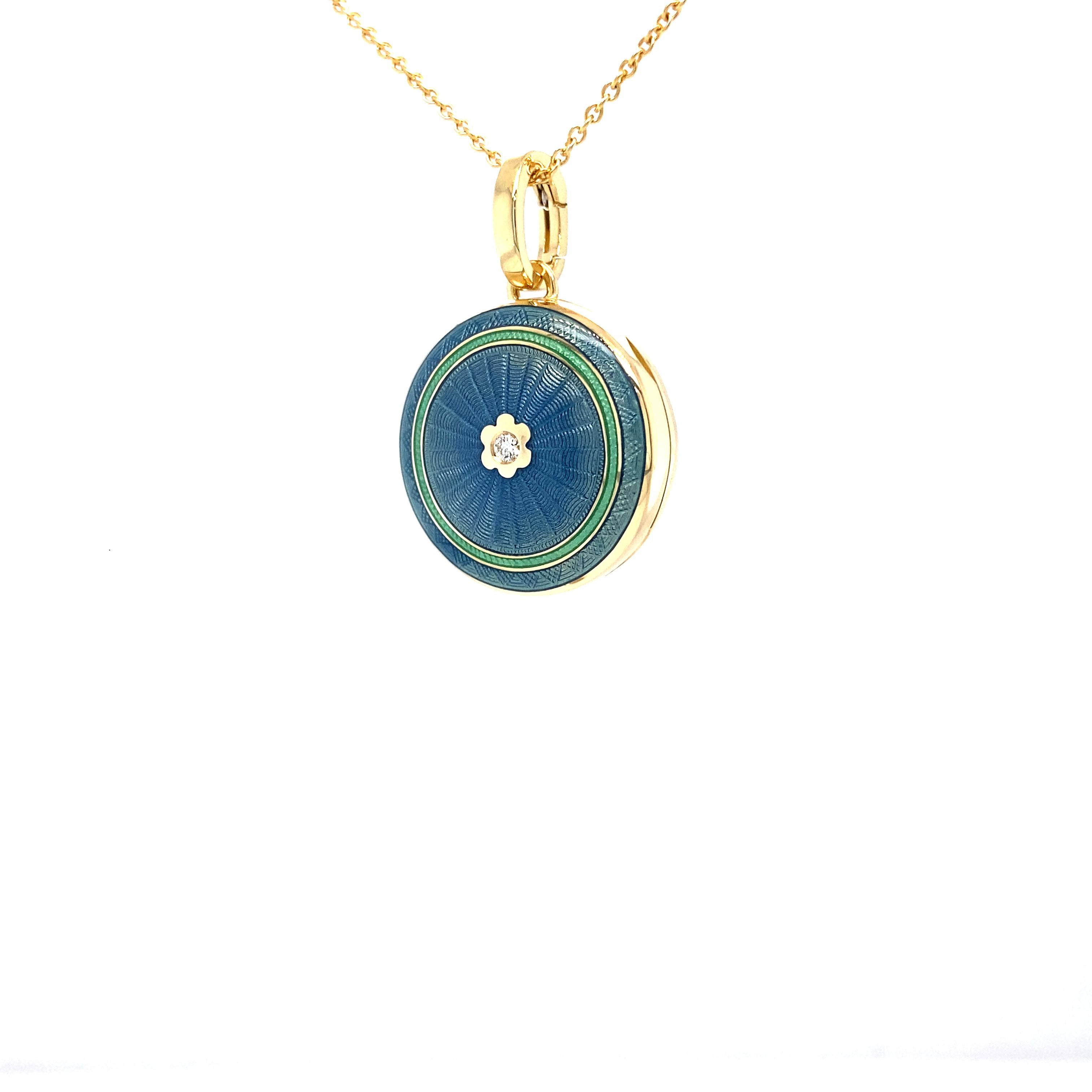 Victor Mayer round locket pendant 18k yellow gold, Hallmark collection, blue and turquoise vitreous enamel, guilloche,  1 diamond, total 0.03 ct, H VS, brilliant cut, diameter app. 21.0 mm

About the creator Victor Mayer 
Victor Mayer is
