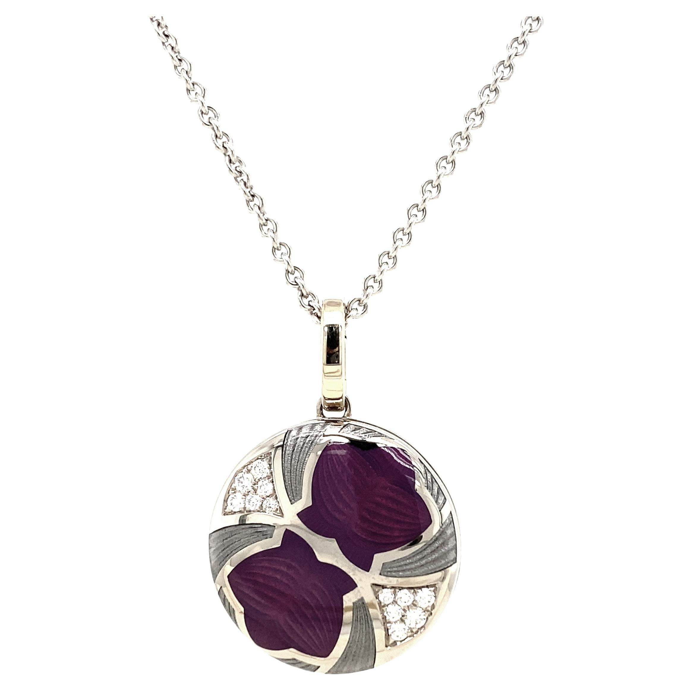 Round locket pendant necklace, 18k white gold, Merian Collection, opalescent purple and grey vitreous enamel, 12 diamonds, total 0.19 ct G VS, brilliant cut

About the creator Victor Mayer
Victor Mayer is internationally renowned for elegant
