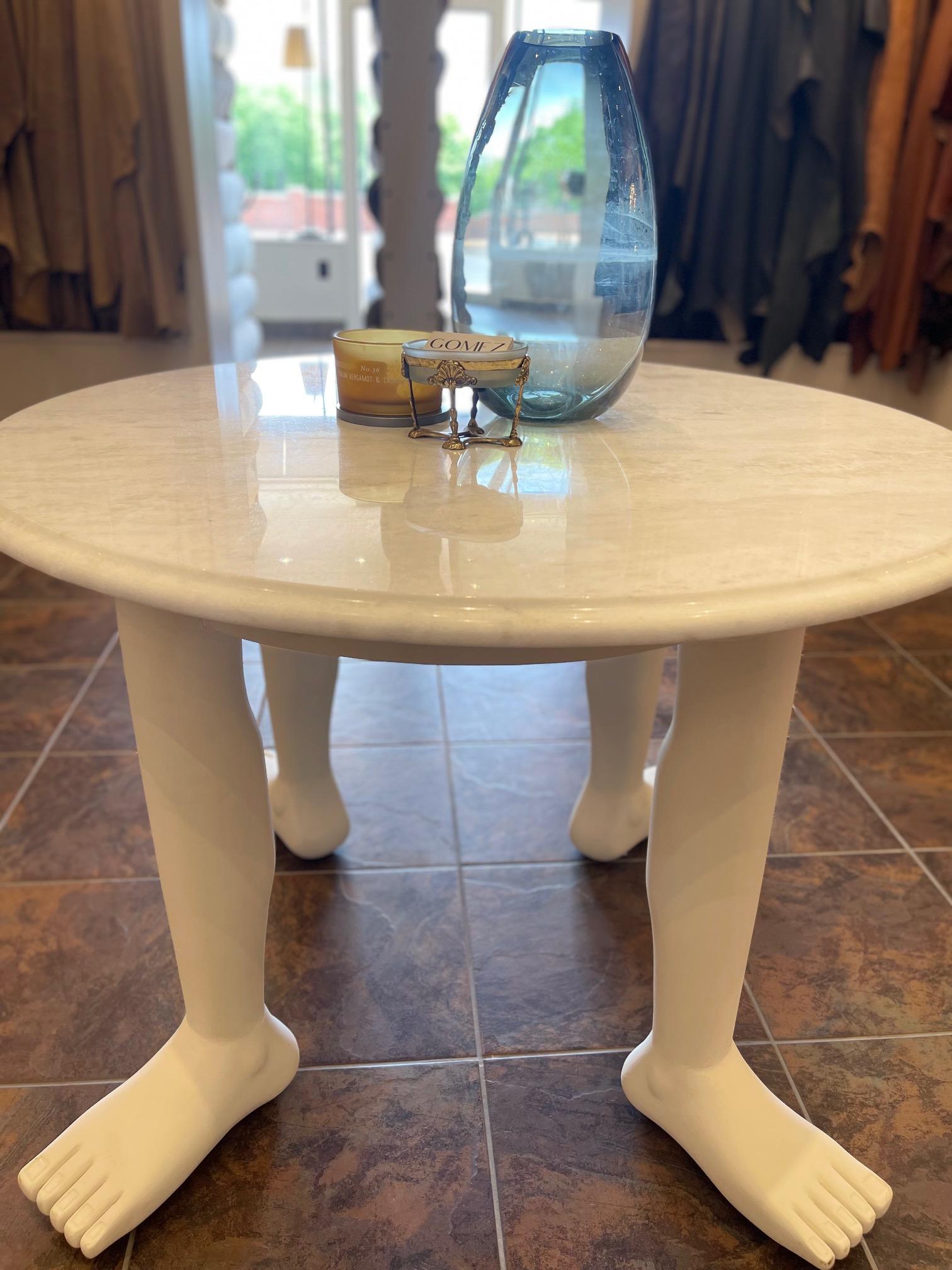 A table that is also a sculpture. Made from fine mahogany wood and imported marble, this table has 4 legs with a medium sized round table top. The legs are handcrafted and finished with a cotton white paint. The designer Jose Gomez, created this