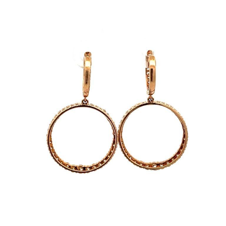 Indulge in luxury and elevate your style with these stunning rose gold hoop earrings. Crafted from high-quality 14k gold, this timeless piece is perfect for any occasion. These fashion design earrings have a shiny row of round white diamonds making