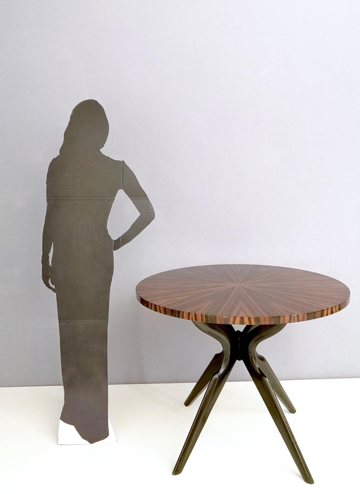 This table features an ebonized beech pedestal and a Macassar ebony top.
It is a vintage item therefore it might show slight traces of use, but it is in excellent original condition and ready to become a piece in a home.

Measures: Diameter 100