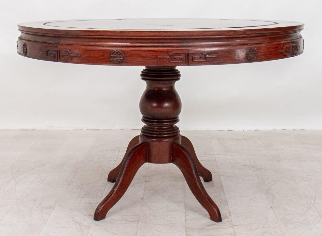 Round Mahogany Pedestal Table, 20th century, with geometric motif on frieze over four spider legs.