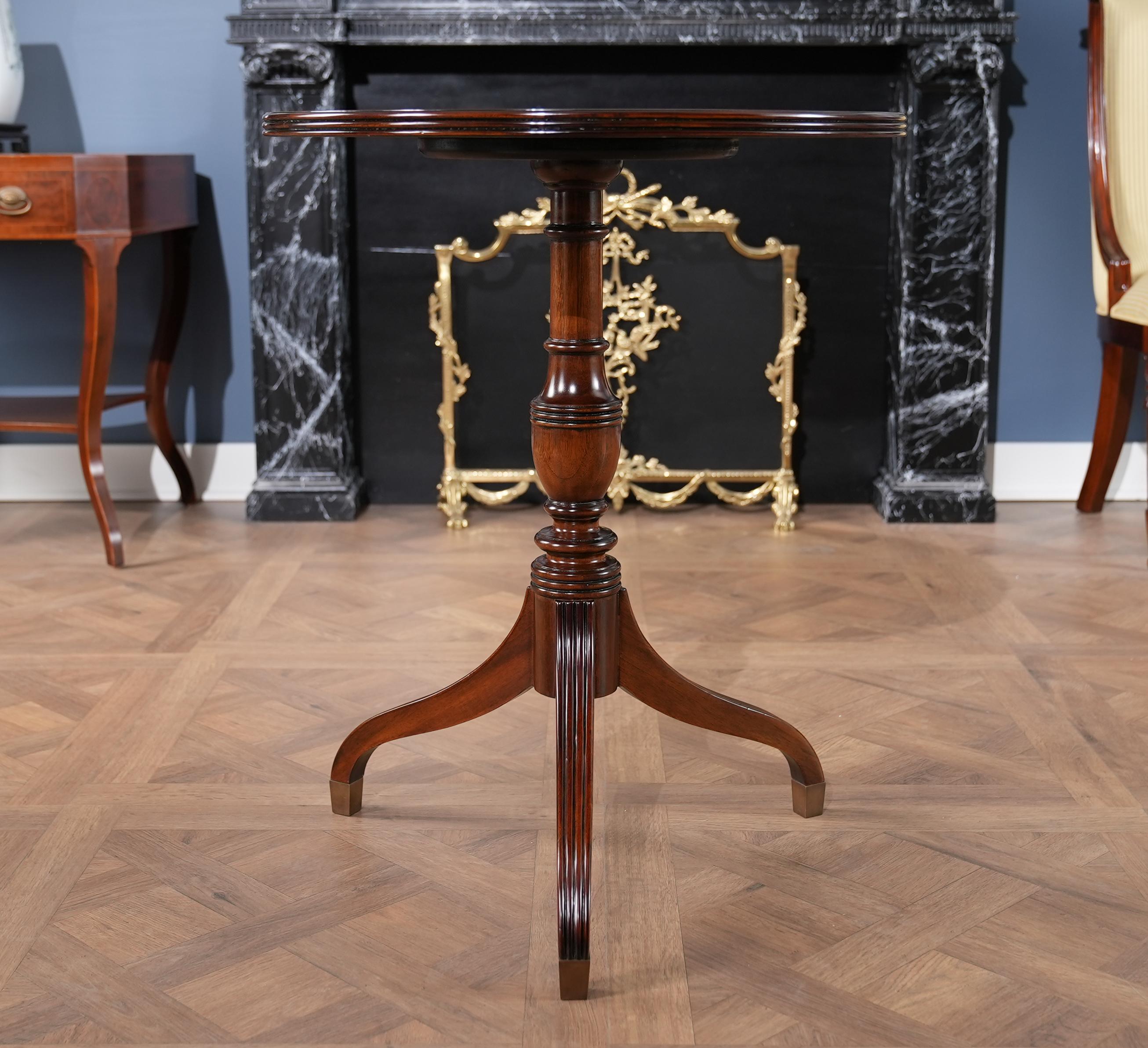 A high quality, Round Mahogany Table with Reeded Edge produced by Niagara Furniture. Beautifully shaped and banded top surrounded by sapele veneers, the entire table supported by three curved and shaped solid mahogany legs, dovetailed into the