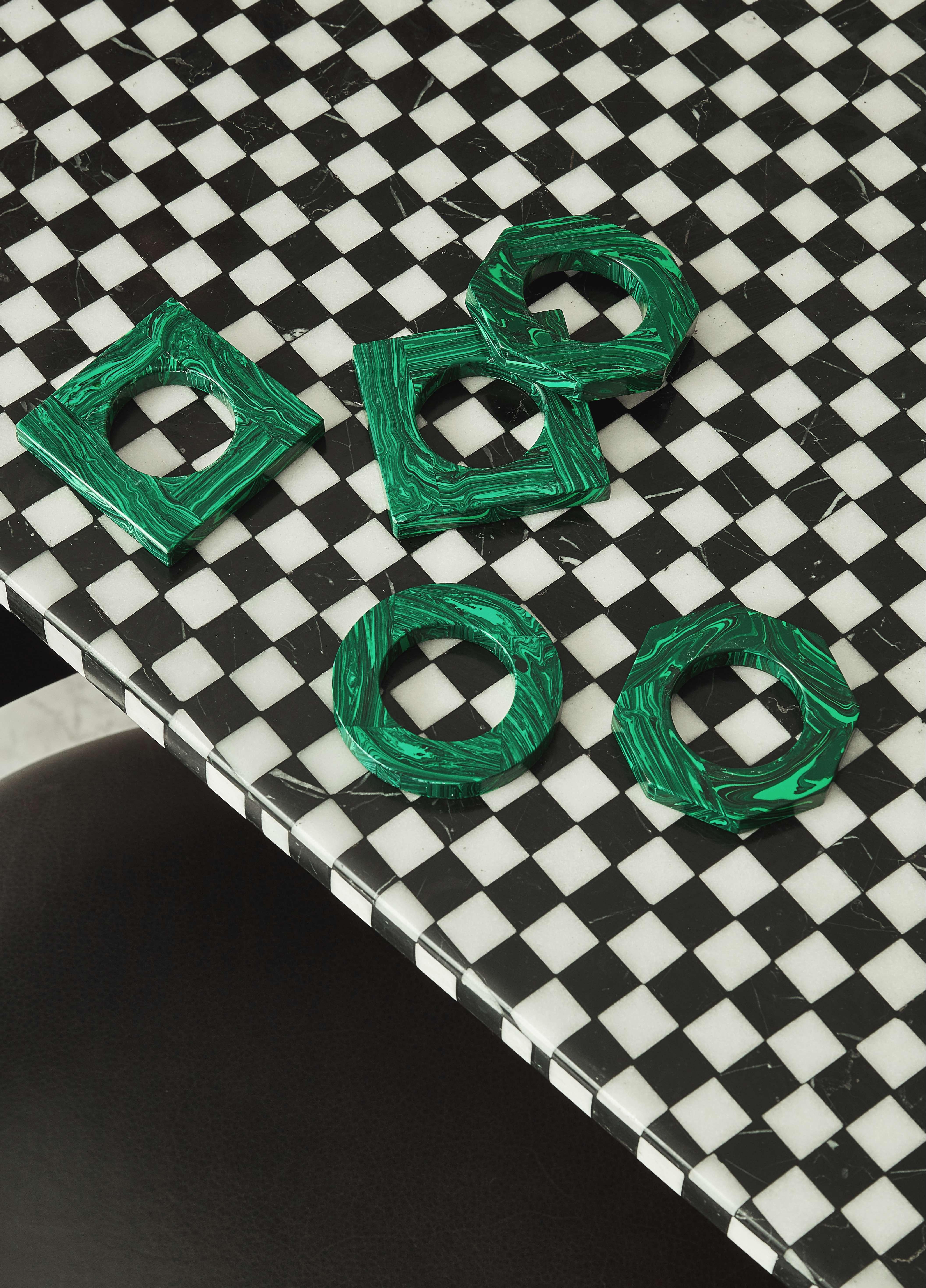 Our luxurious Malachite Napkin Rings are completely made with natural malachite. They are the perfect finishing touch for a beautiful table. Three different geometric shapes available: circular, square and octagonal. 

All of the pieces in this