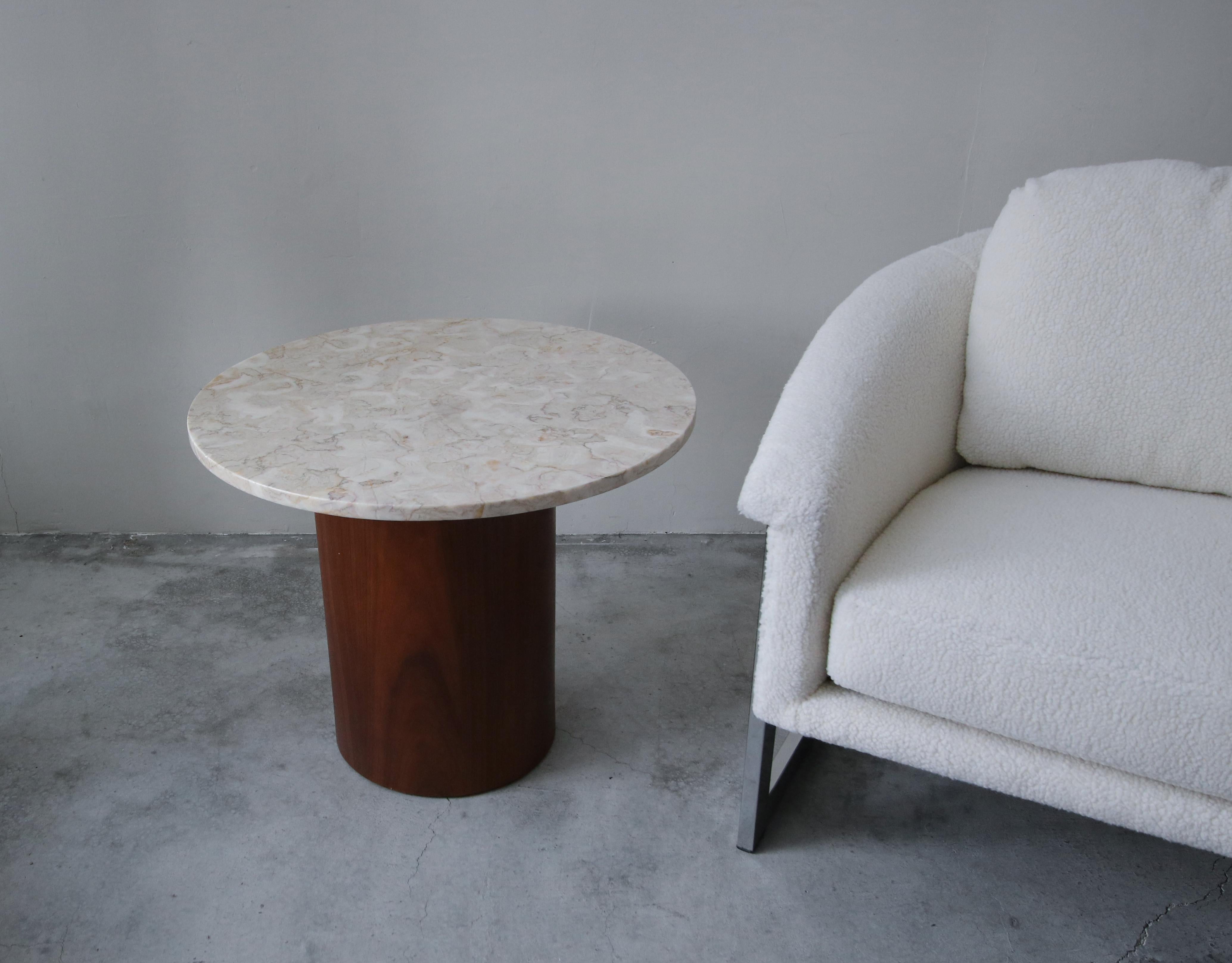 Gorgeous round marble and walnut drum side table. Perfect side table or table between a pair of chairs. Could also be used to display your favorite sculpture or art piece.

Table is in excellent condition. No damage to be noted.