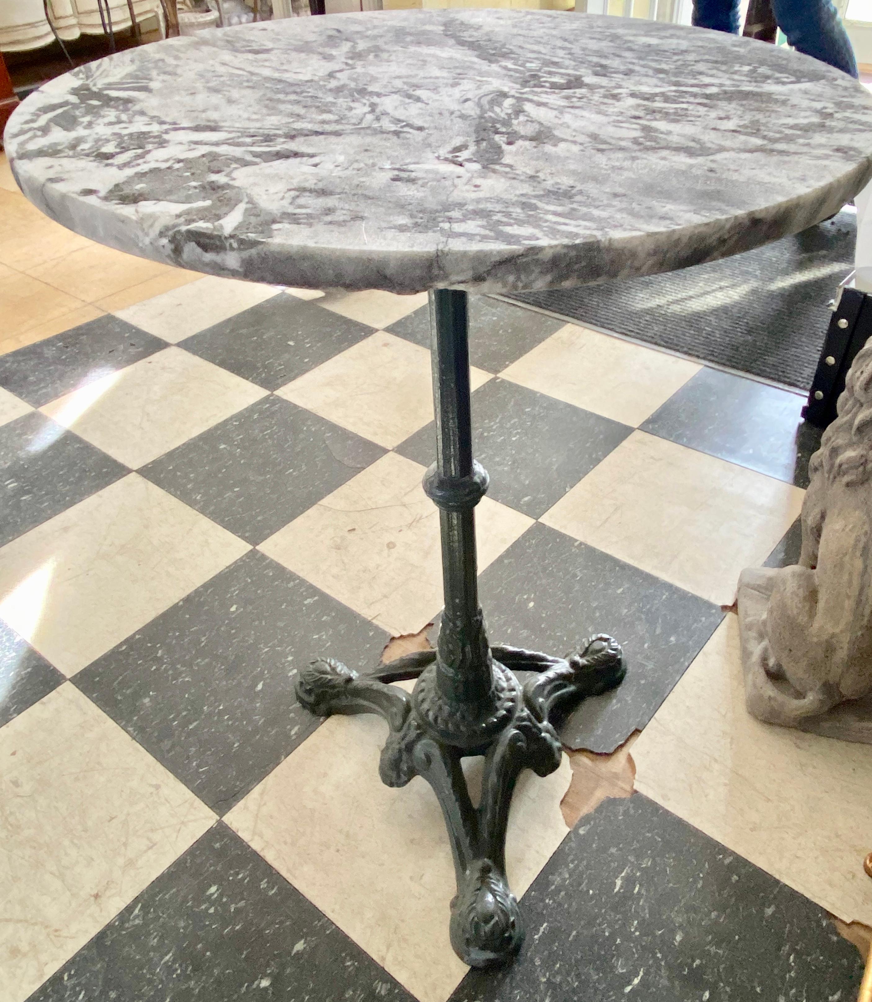 A fine vintage French café or bistro table with a round or circular marble top. painted cast iron pedestal base. Great for an indoor or outdoor patio or garden.
Dimensions: H 27.78