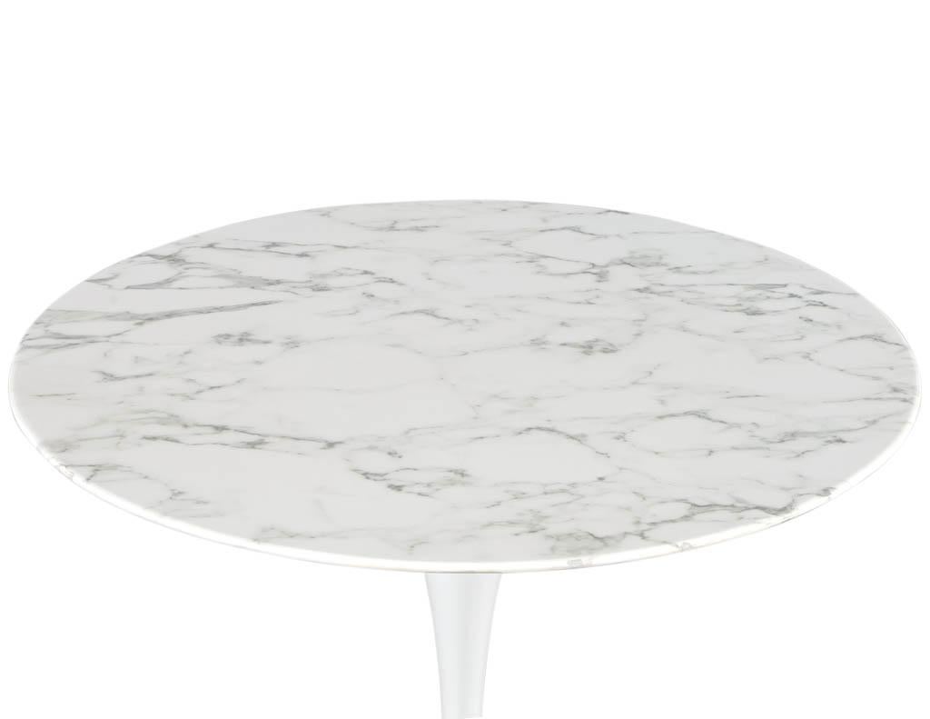 Round Marble Top Breakfast Table with Polished White Tulip Base. Original from the 1970’s. Featuring 2 tone marble top with polished white metal tulip pedestal. Based on the iconic mid-century knoll design. Price includes complimentary curb side