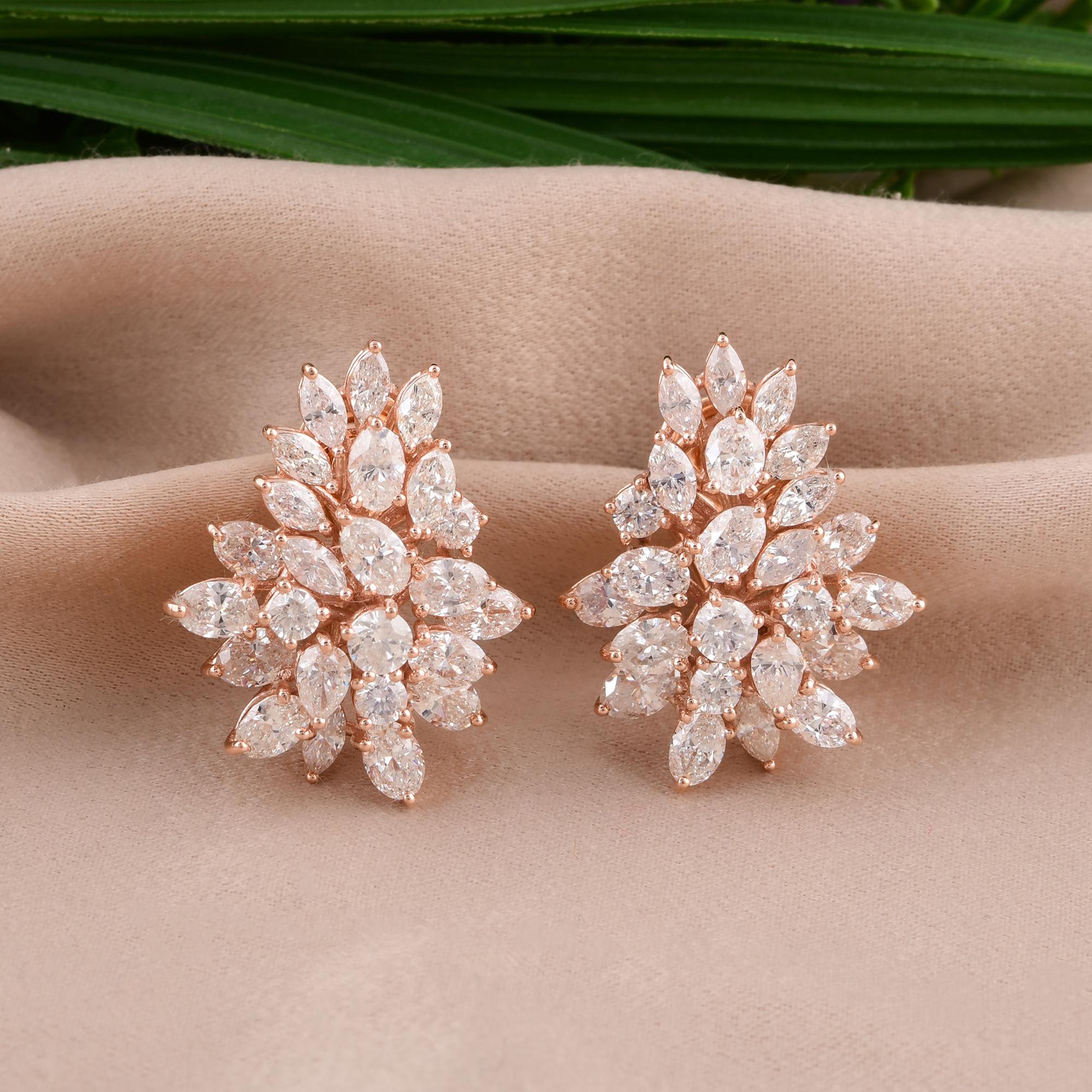 Indulge in the exquisite beauty of these Round, Marquise, and Oval Diamond Earrings, meticulously handmade in luxurious 14 karat rose gold. This stunning pair of fine jewelry is a harmonious blend of classic elegance and modern sophistication,