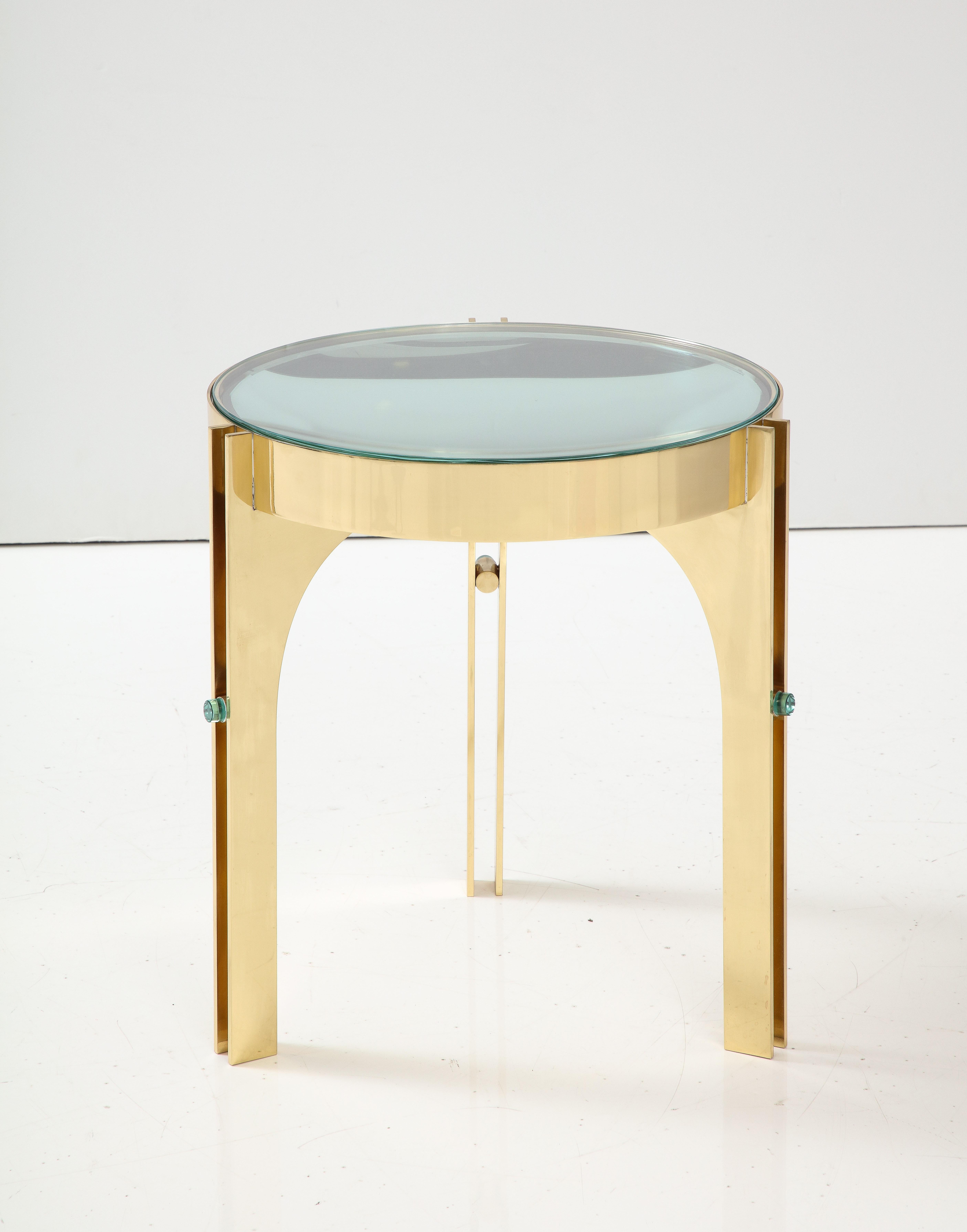 Bespoke and specially designed round martini drinks side table inspired by Max Ingrand Fontana Arte. This side table consists of a round structure in lacquered brass suspended by 3 architecturally designed brass legs. 12 mm round solid soft green