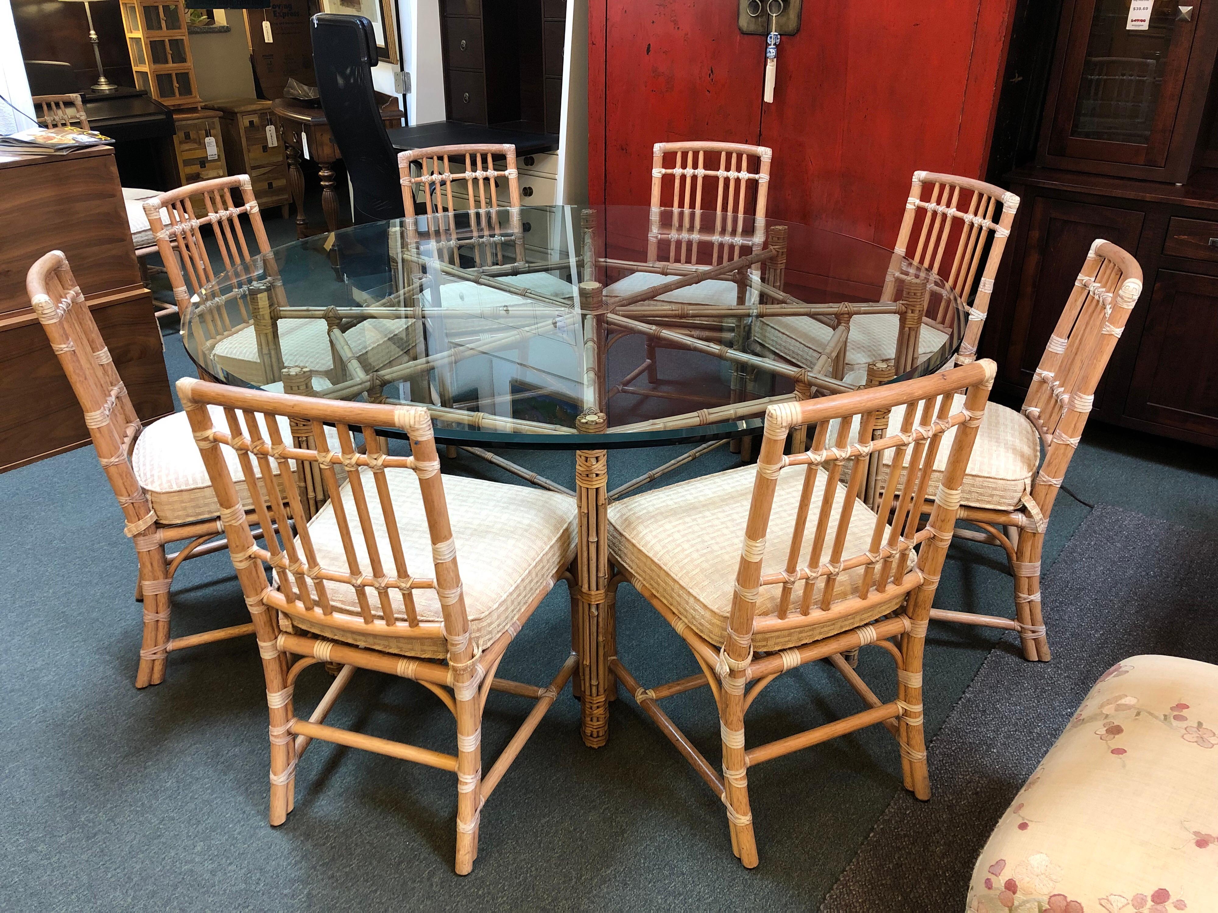 Large McGuire dining table.

Designed by John McGuire. Beautiful bamboo rods are lashed together with McGuire’s signature raw hide lacing in an intricate pattern that comfortably seats eight. The base is topped with 3/4? thick round glass top with