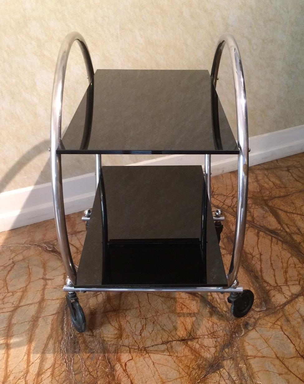 Round metal bar cart from the 1950s.