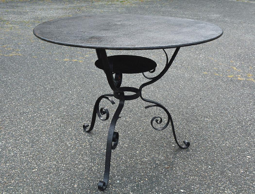 French indoor or outdoor iron bistro dining table. Can be used as dining table in the garden, patio, porch or kitchen. Appropriate for use as end or side table.