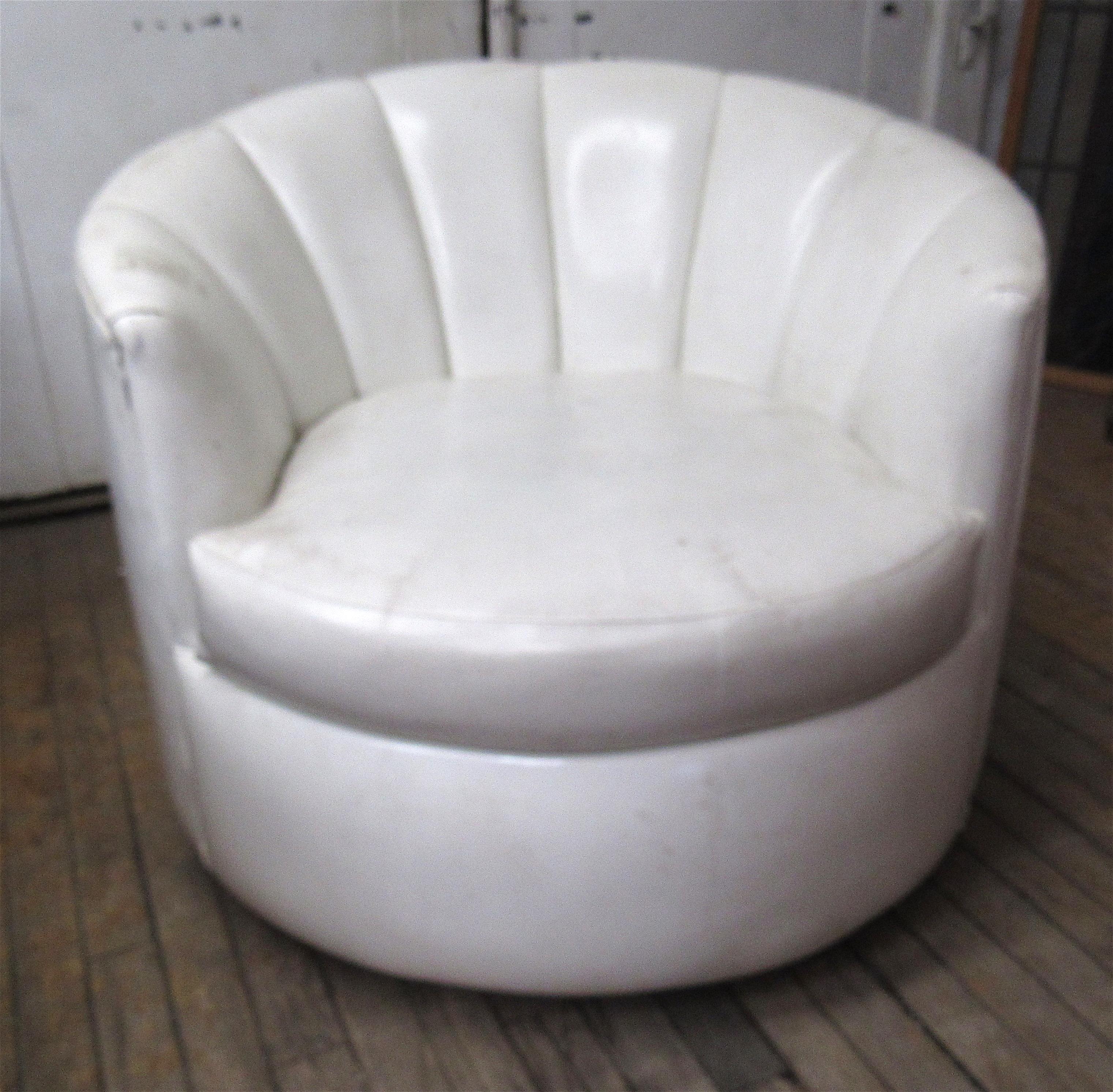 White vinyl club chair with thick cushioning. Clam style lounge chair.
Please confirm location NJ or NY.