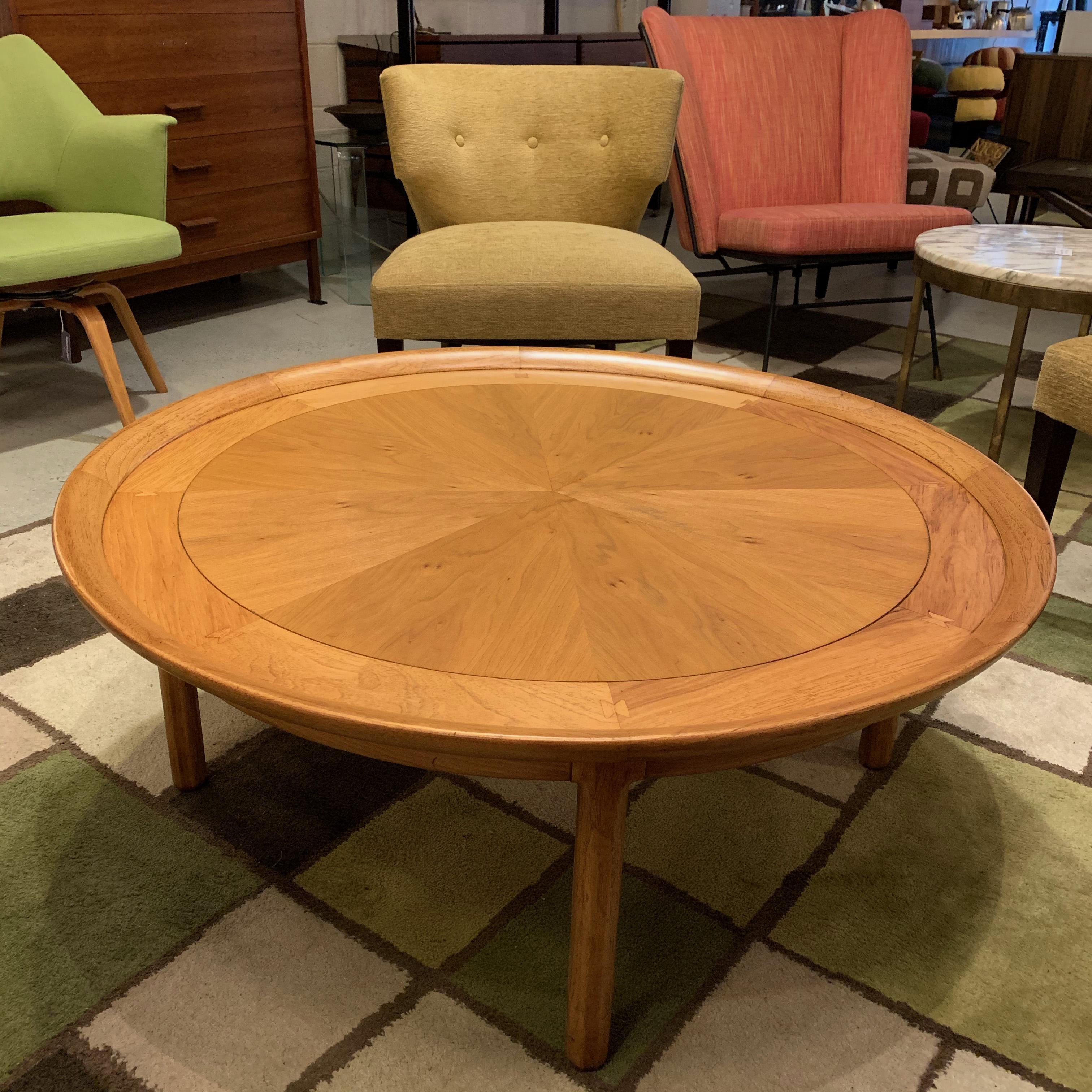 Lovely, Mid-Century Modern, round coffee table by Sophisticate by Tomlinson features a recessed top with sunburst pattern, bookmatched pecan and butternut wood top with butterfly joinery.