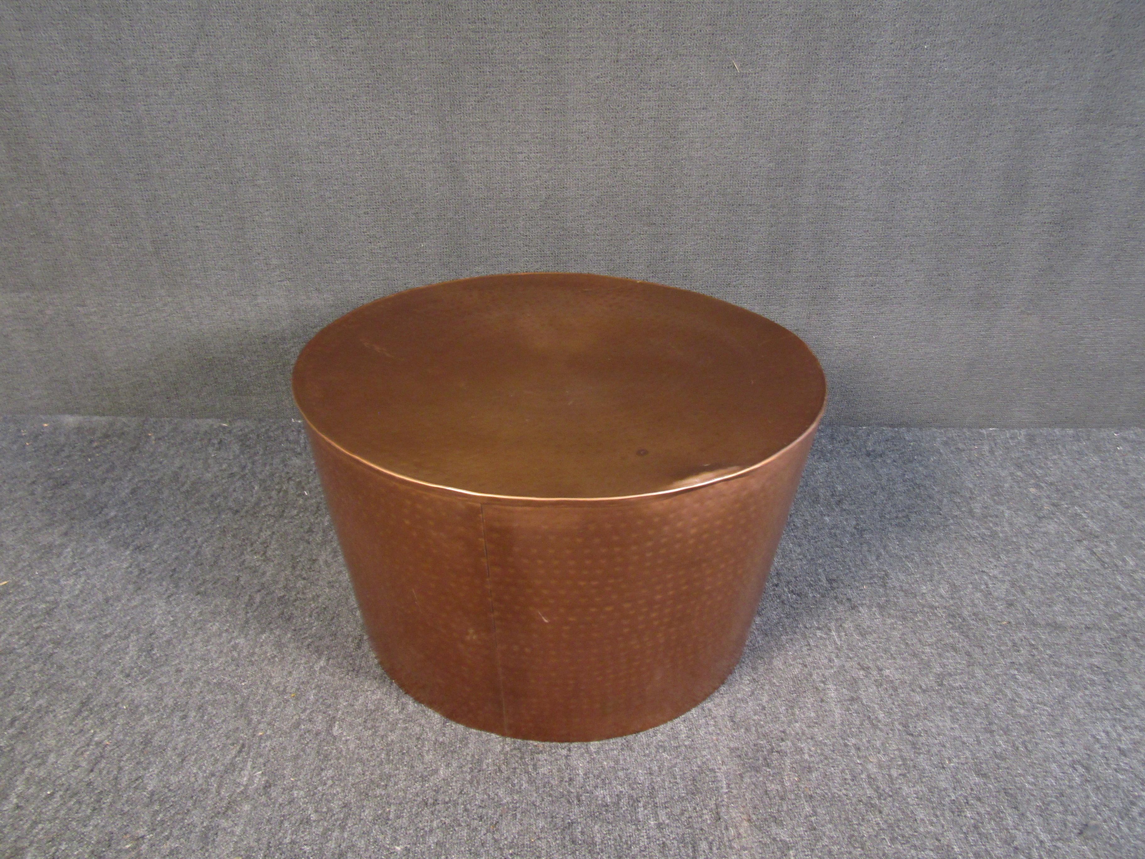 An unusual round side table that is sure to accent any room or space with its unique mid-century look and perforated copper surface. Please confirm item location with seller (NY/NJ).