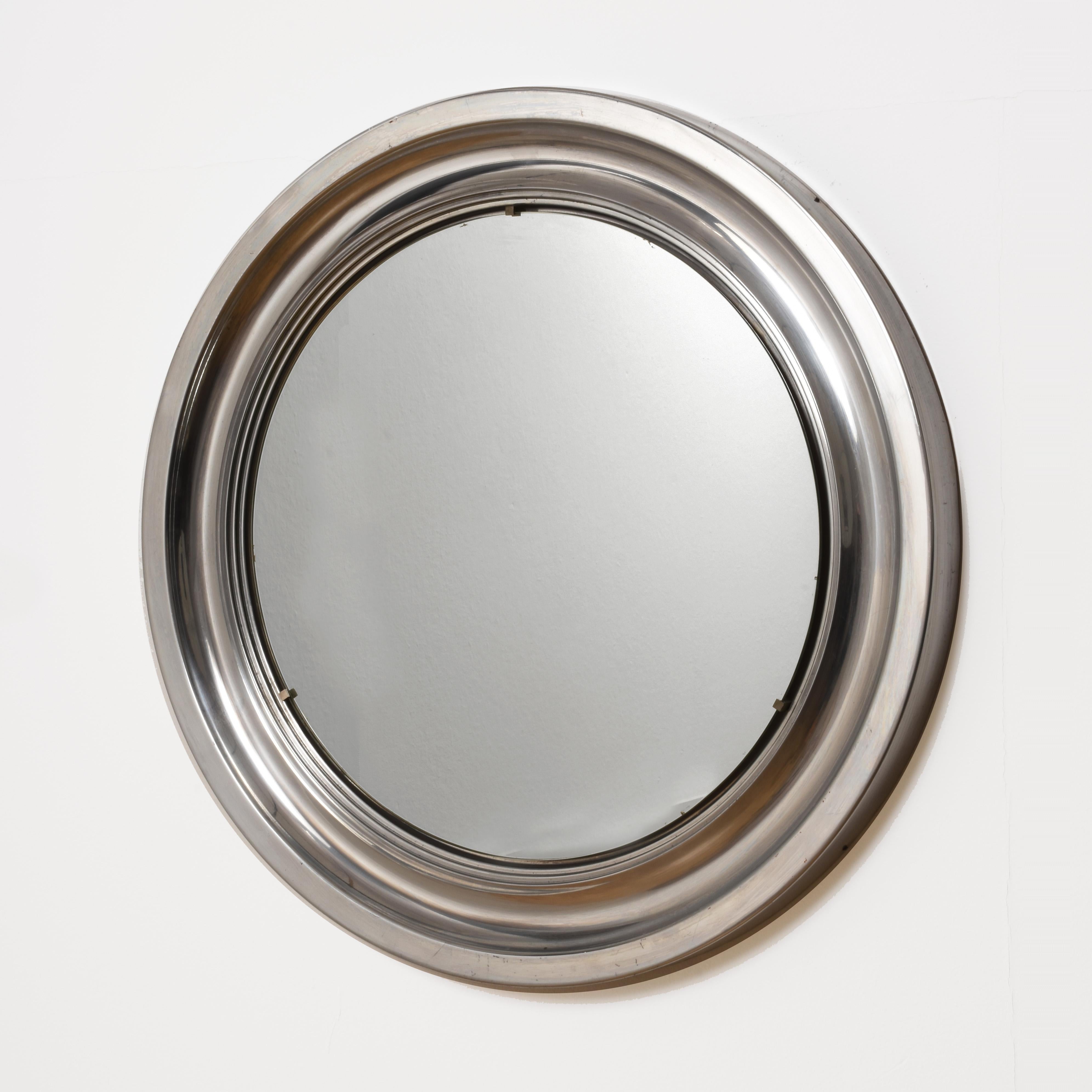 Attributable to Sergio Mazza for Artemide
Italian modernist aluminum mirror.
The original mirror in the centre is in excellent condition and the frame has a concave centre that creates depth and texture. This simple mirror is quite surprising and
