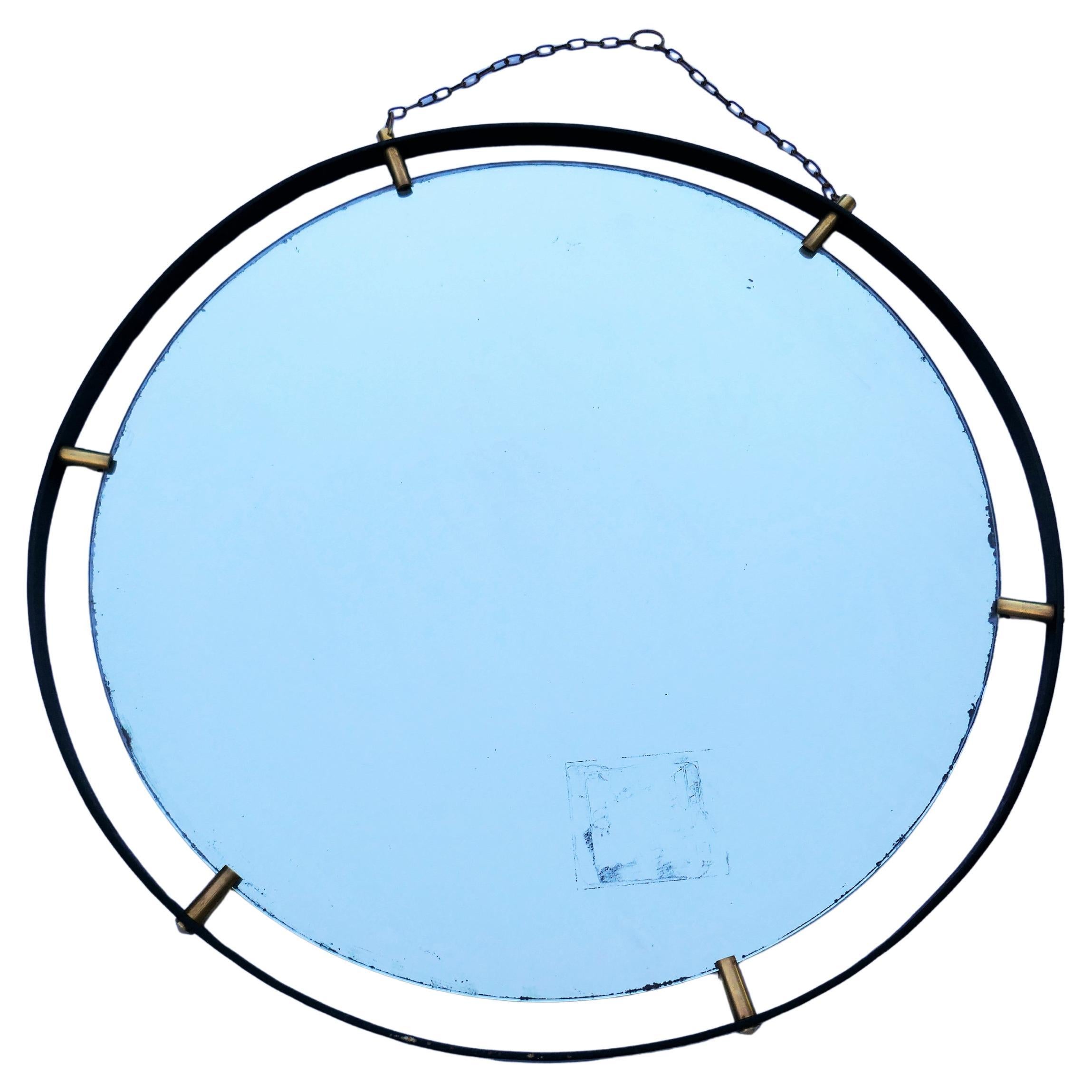 Round mirror attributed to Santambrogio and De Berti.
Oxidation due to a glassworks label on the back with the date 1963.
Possible mirror reproduced.
Thanks you