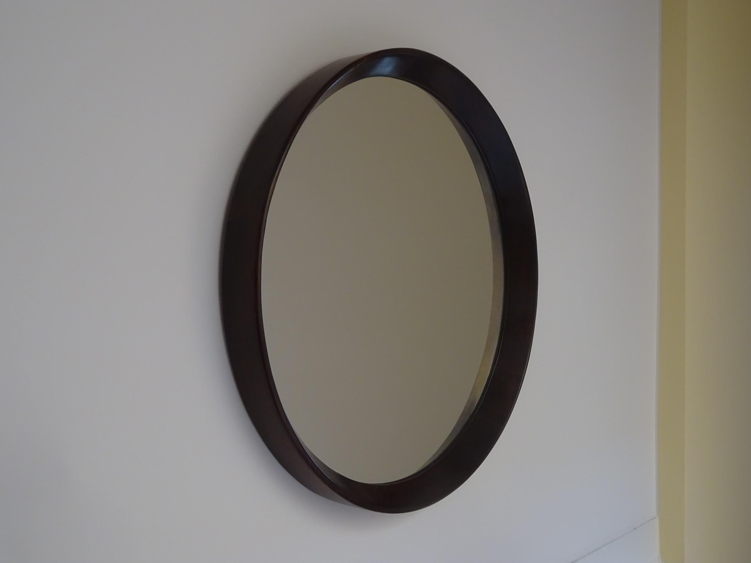 Round mirror in solid Brazilian wood, probably designed by Sérgio Rodrigues.