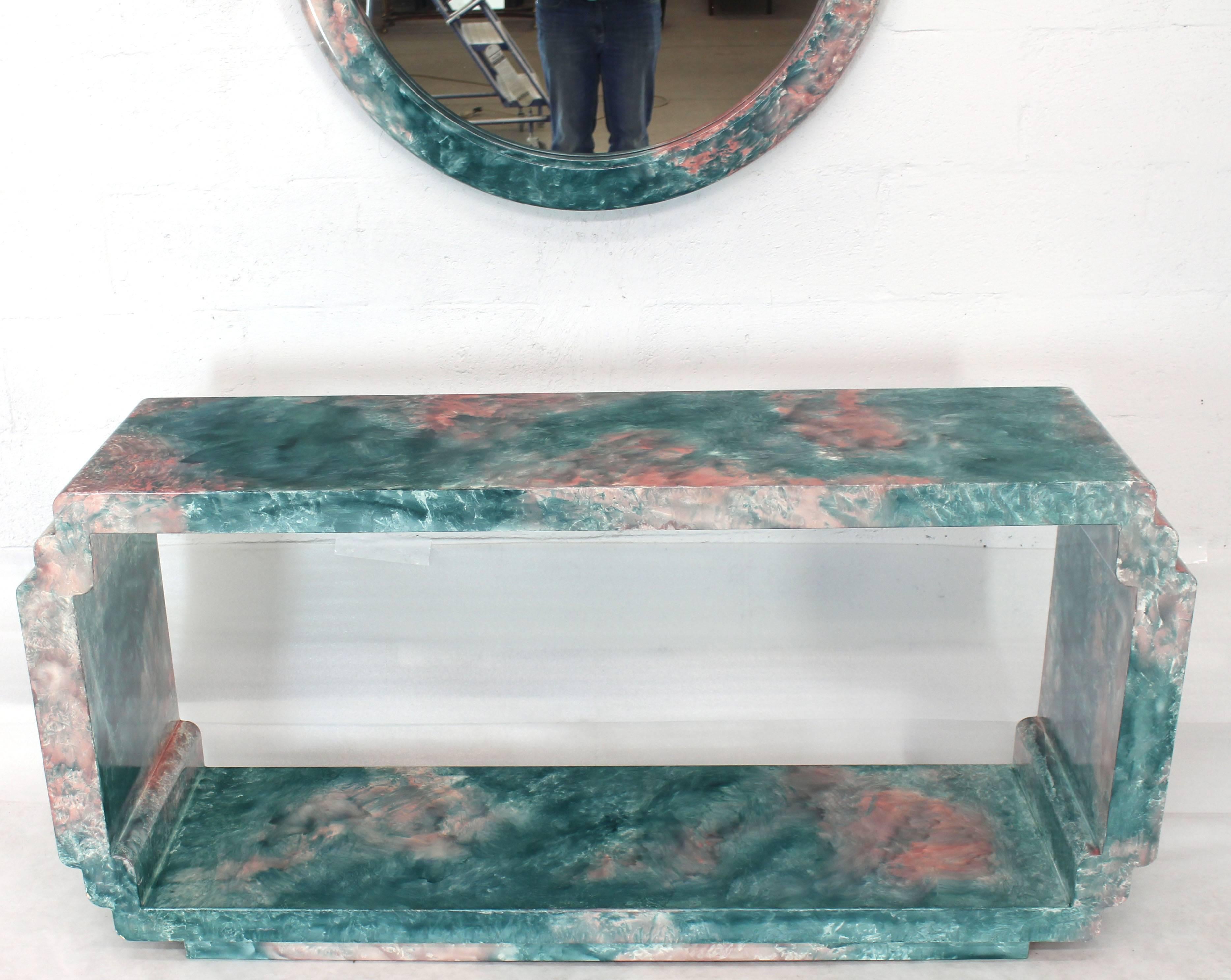 Artistic lacquered set of round frame mirror with matching console table. Mirror measures 35