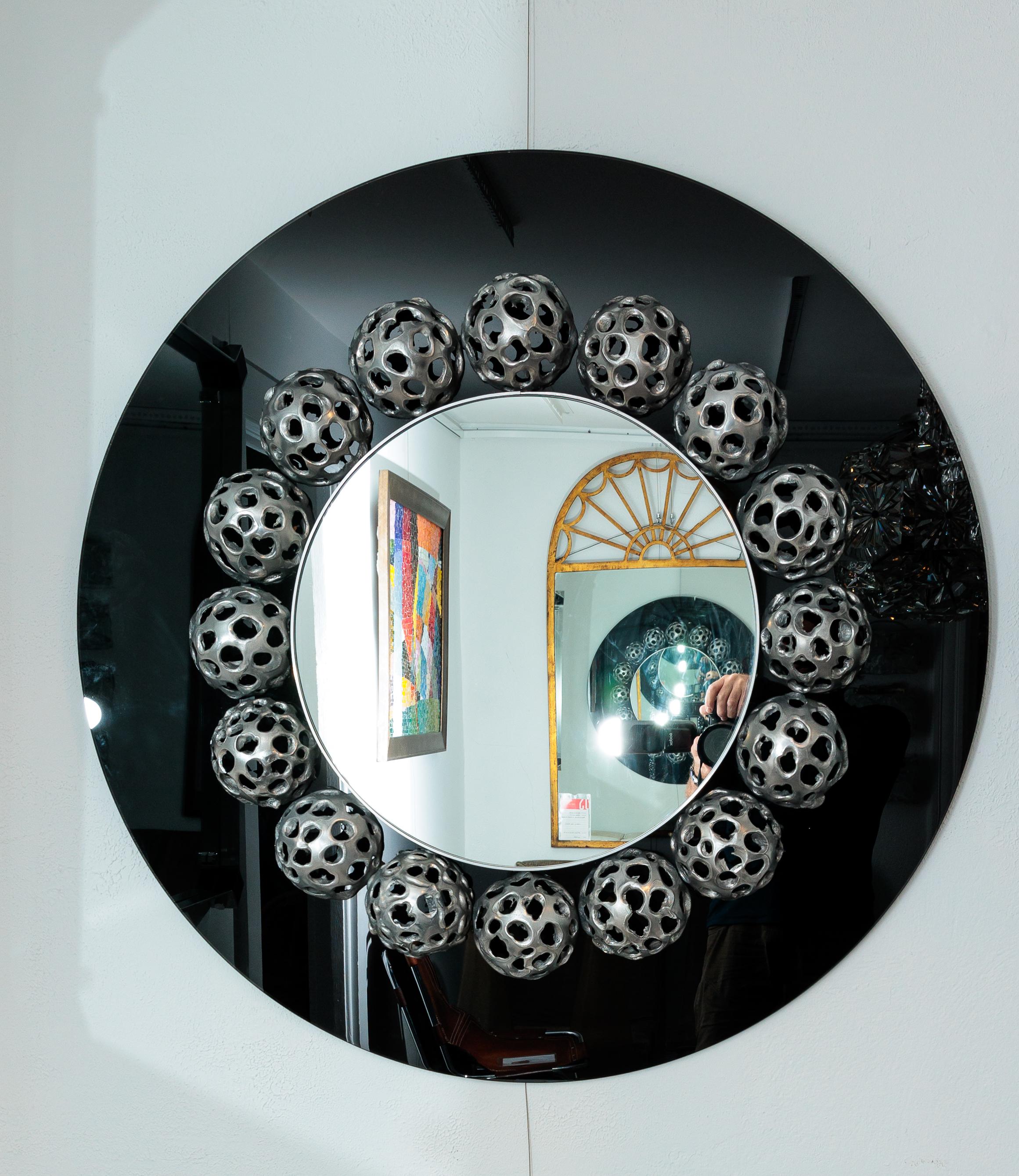 Modern Round Mirror with 17 Metal Perforated Orbs on Black Glass For Sale