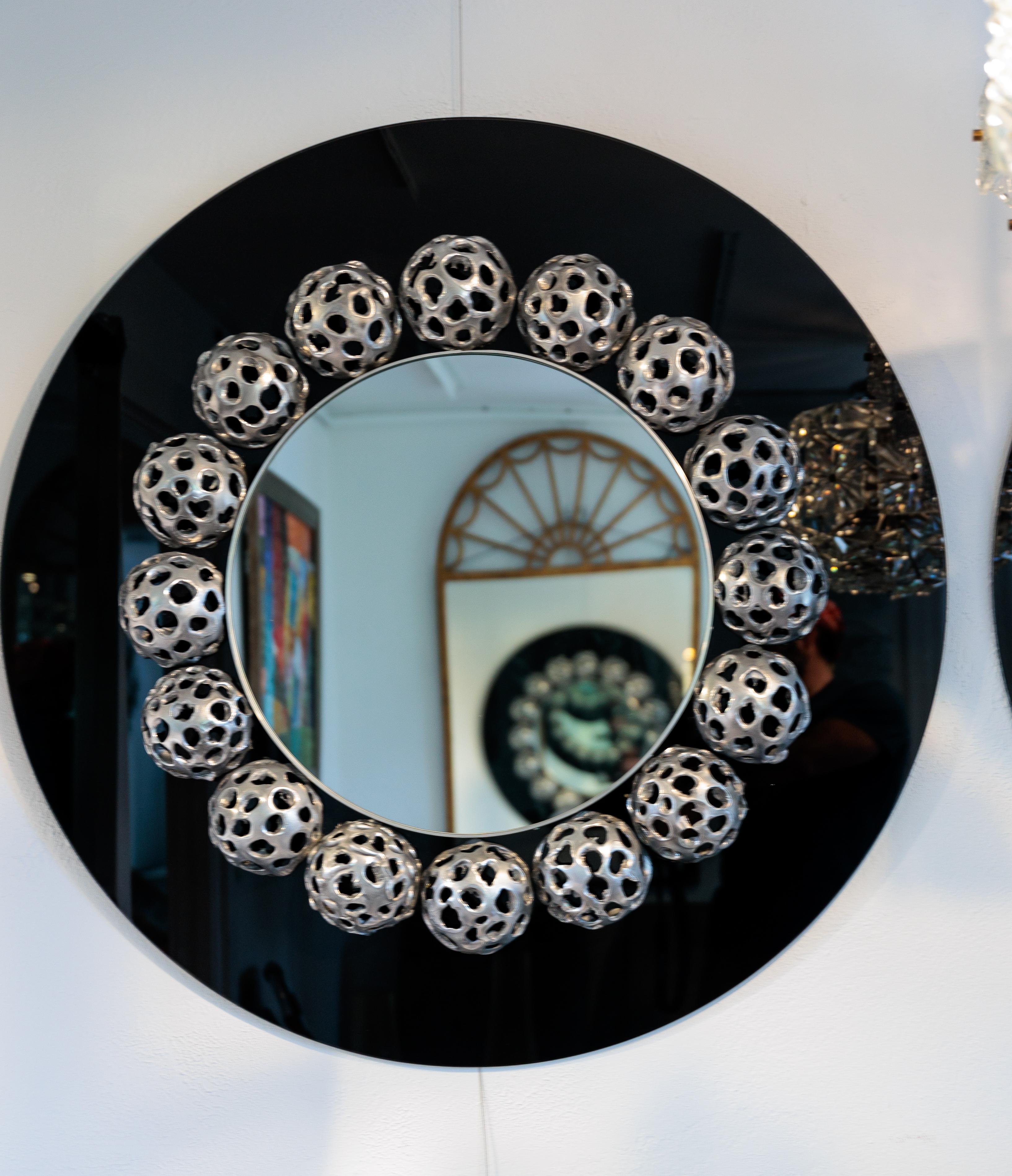 Round Mirror with 17 Metal Perforated Orbs on Black Glass For Sale 1