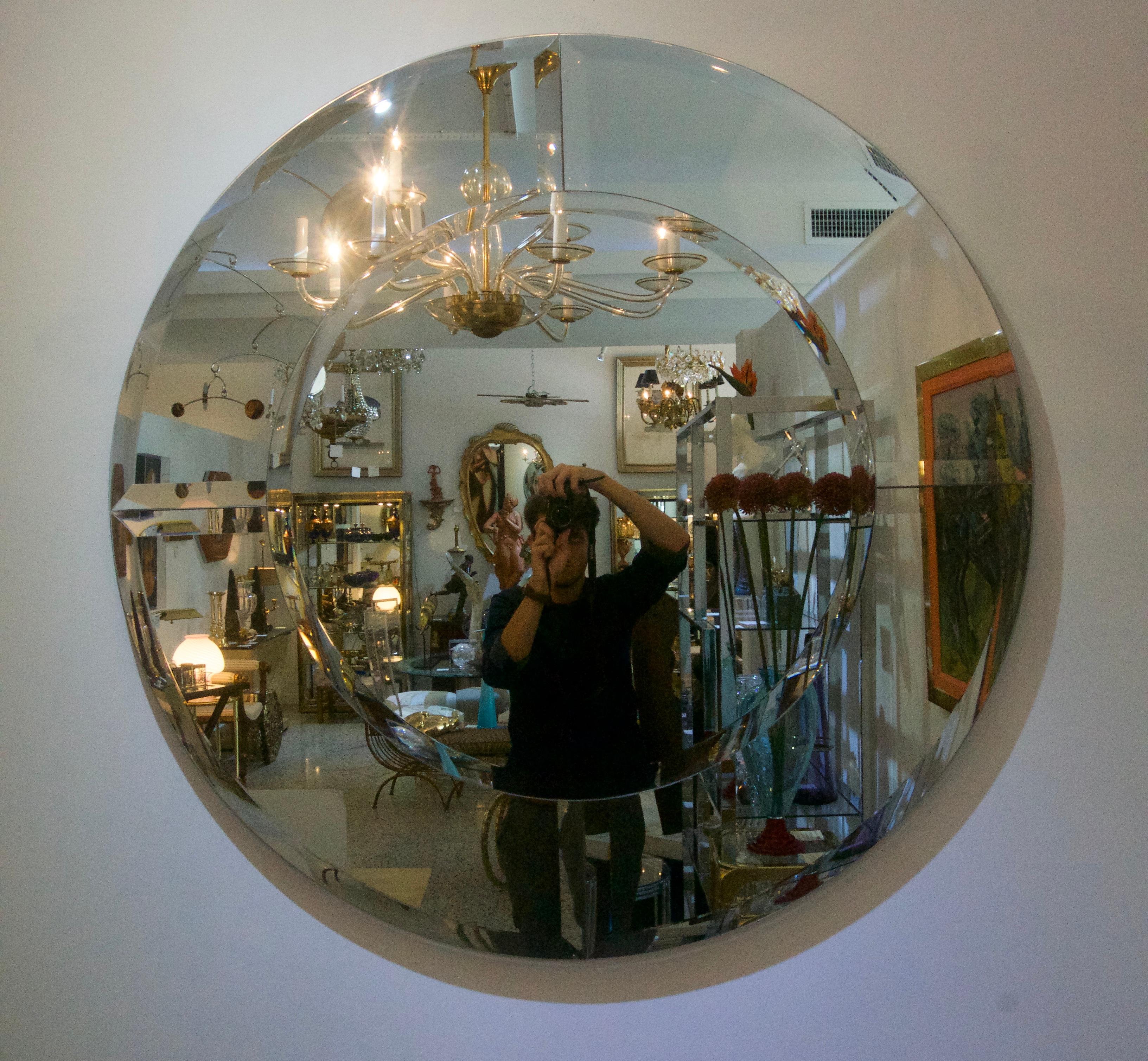 This large scale and clean lined Art Deco style wall mirror is in the manner of a mirror designed by Karl Springer.

Note: Projects from wall 1.50