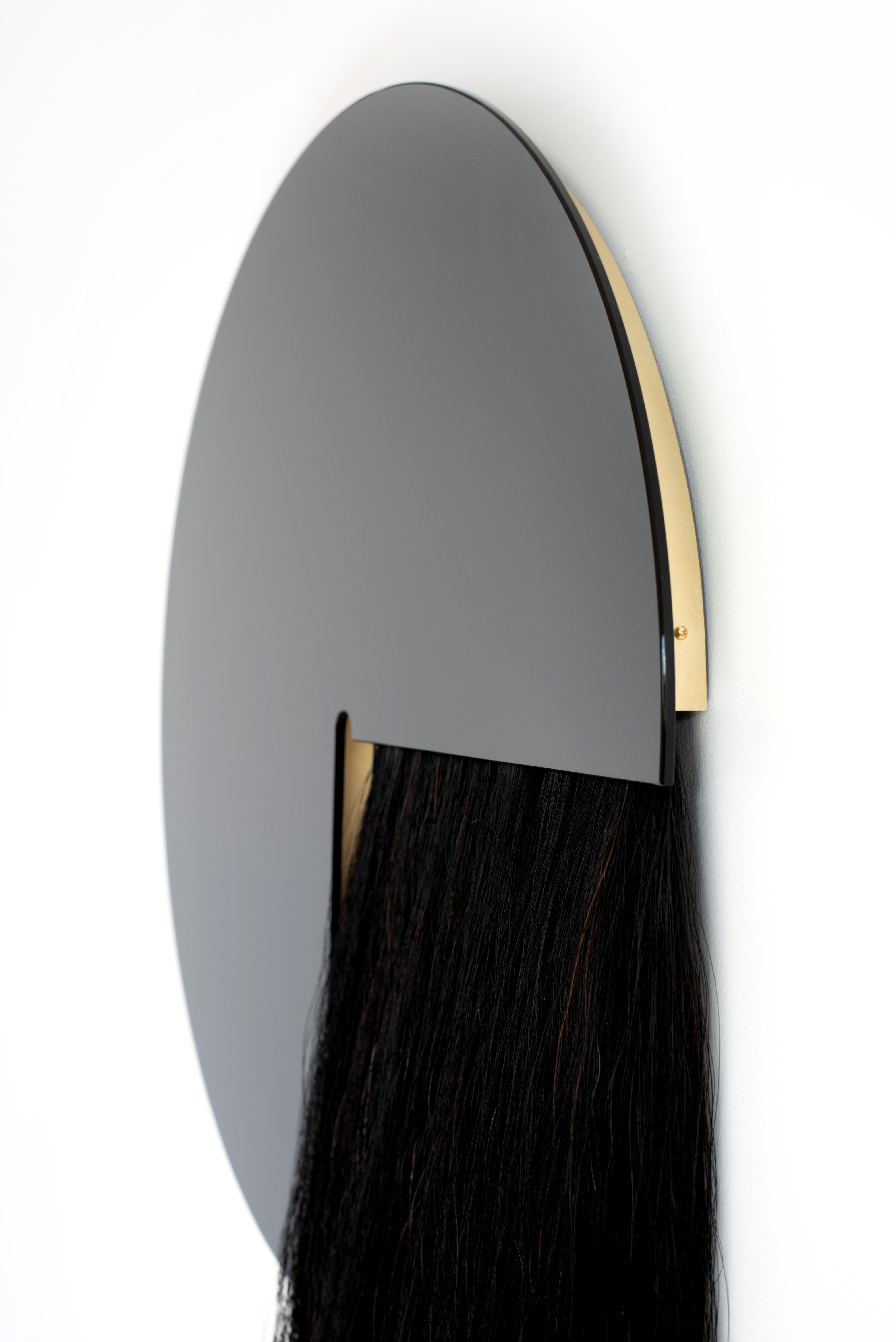 The Aries mirror partners Mongolian horsehair and mirror to create a juxtaposition of material and texture.

Currently available in black mirror with black horsehair.

Shown here in black mirror with black horsehair and bronze mirror with salt