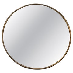 Miroir rond avec verre convexe et cadre simple en laiton