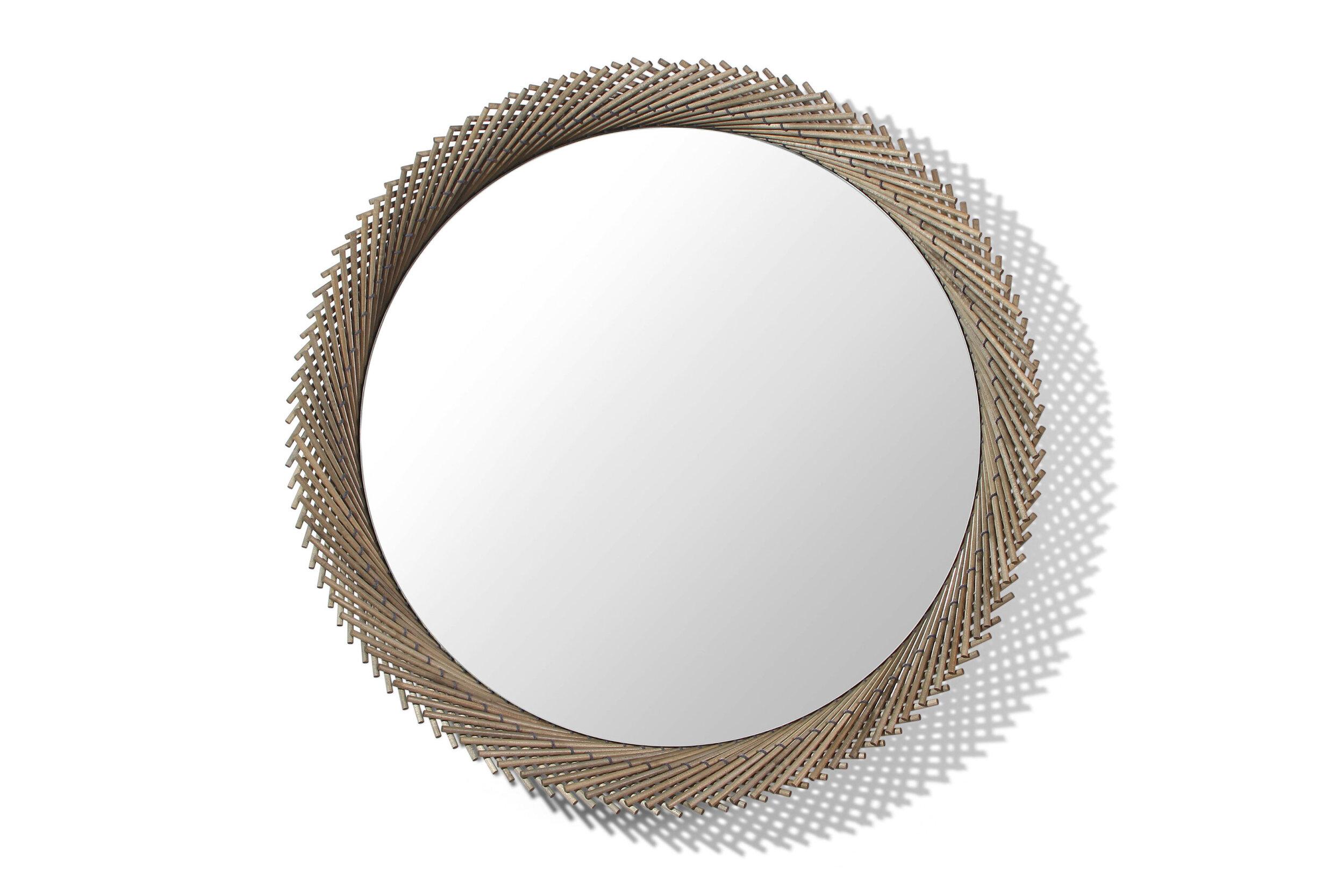 The Mooda Mirror is composed of a set of dowels stitched together to create a beautiful geometric edge around the glass. The mirror in turn reflects the dowels along its circumference, completing the traditional form of the Mooda.   Available in two