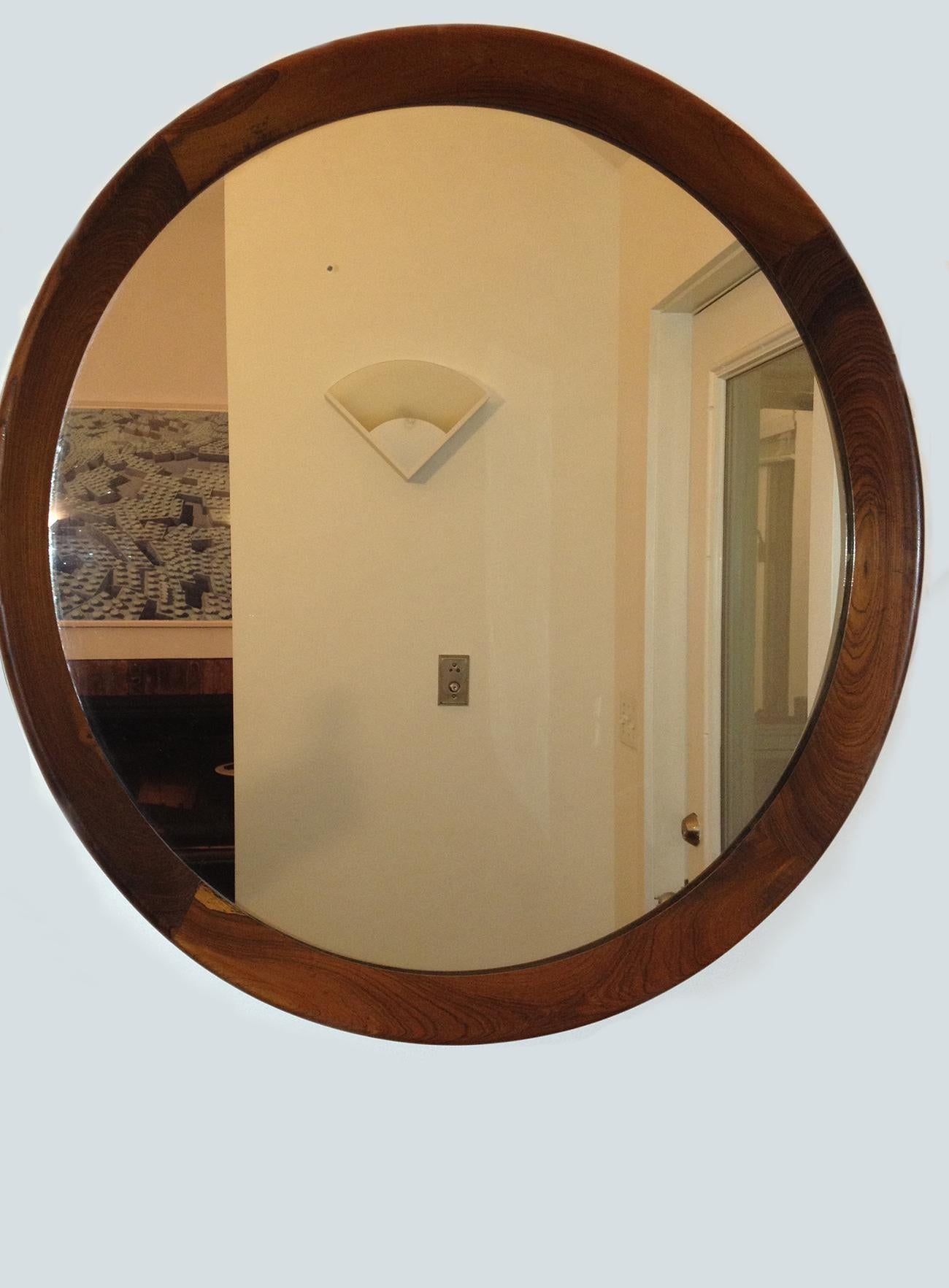 Round Grasselli mirror with wood frame. Designed by Sergio Rodrigues, Brazil, circa 1960.