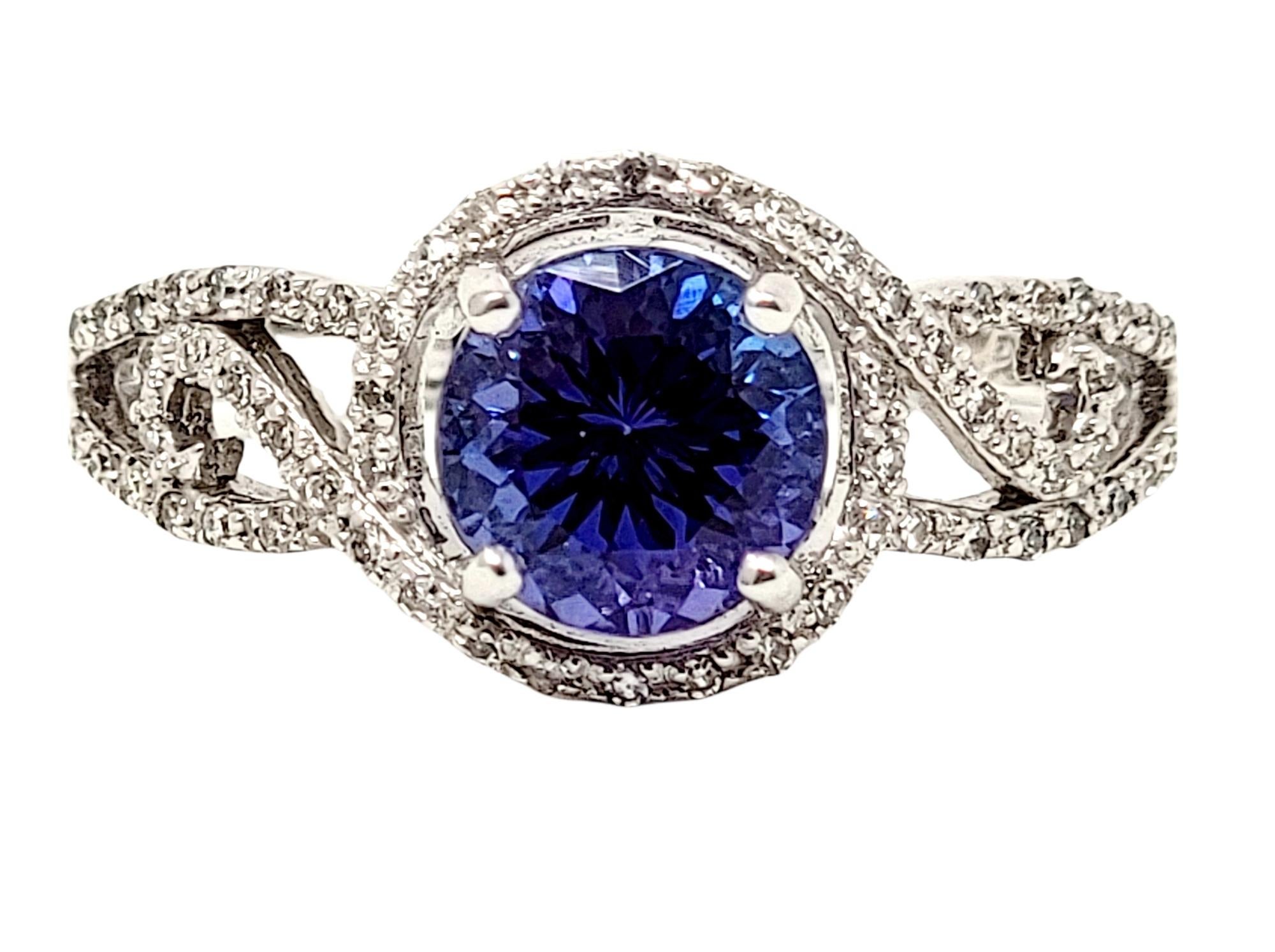 Ring size: 7

Absolutely gorgeous tanzanite and diamond halo ring with delicate swirl details. 

Ring size: 7
Metal: 18K White Gold
Weight: 3.73 grams
Height: 6.69 mm
Natural Tanzanite: 1.32 ctw
Sapphire cut: Round Mixed
Natural Diamonds: .16 ctw