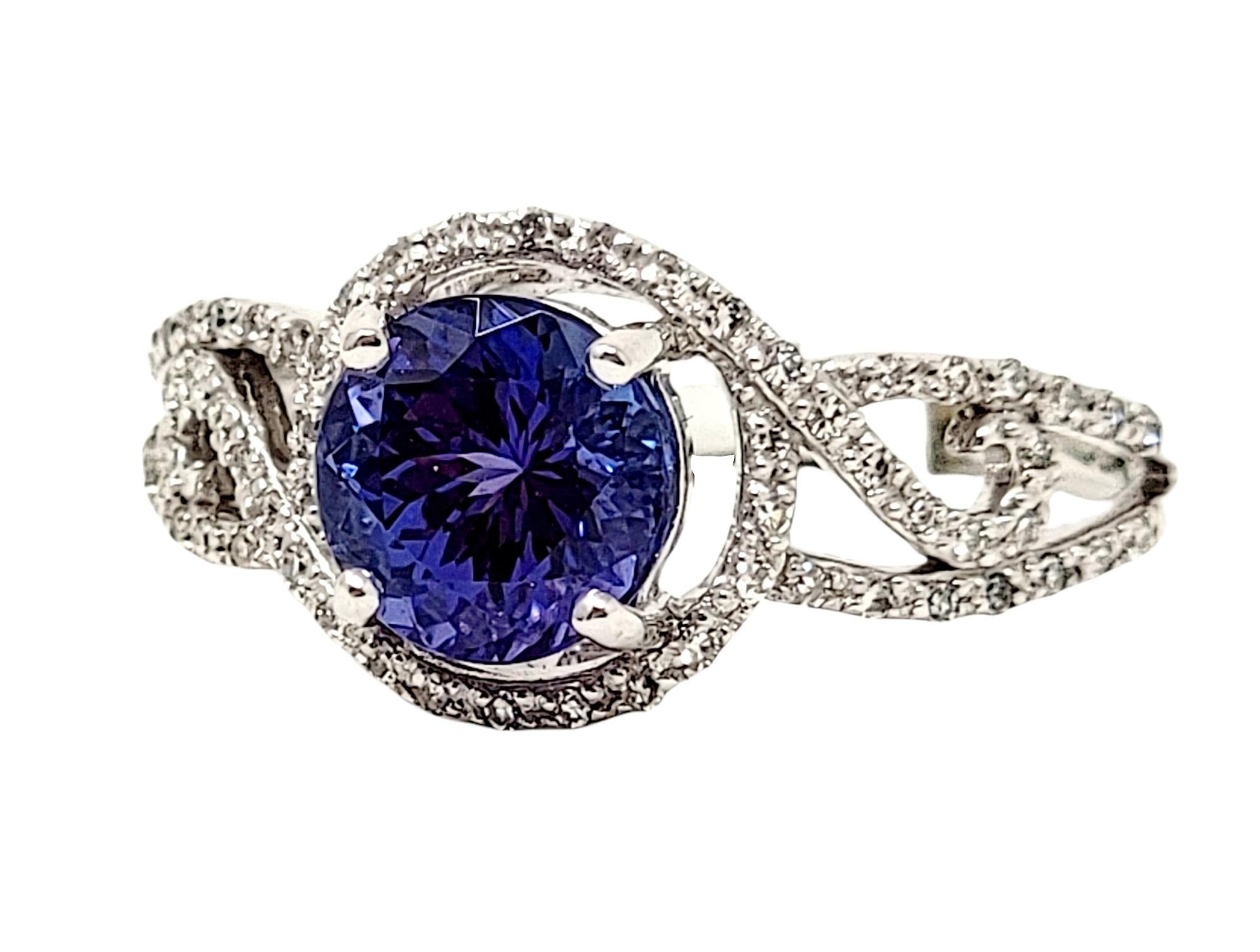 Contemporary Round Mixed Cut Tanzanite and Diamond Halo Solitaire Band Ring in 18 Karat Gold For Sale