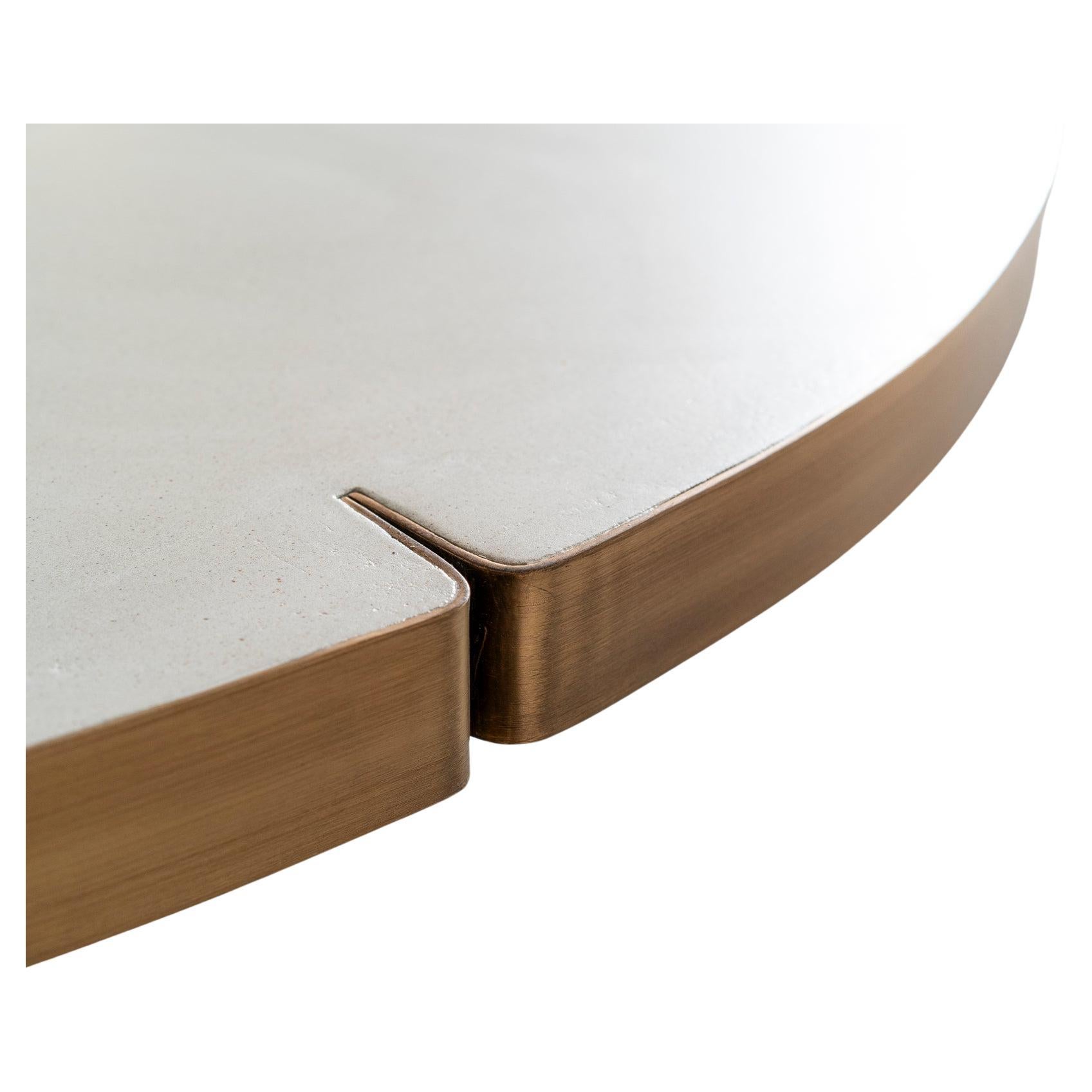 This beautiful table is made out of Mortex and finished with a patinated brushed brass ring which is sealed.
The size is fit for 4 persons.
A round table has 2 big advantages ; it gives more space in tight rooms without losing space on the table