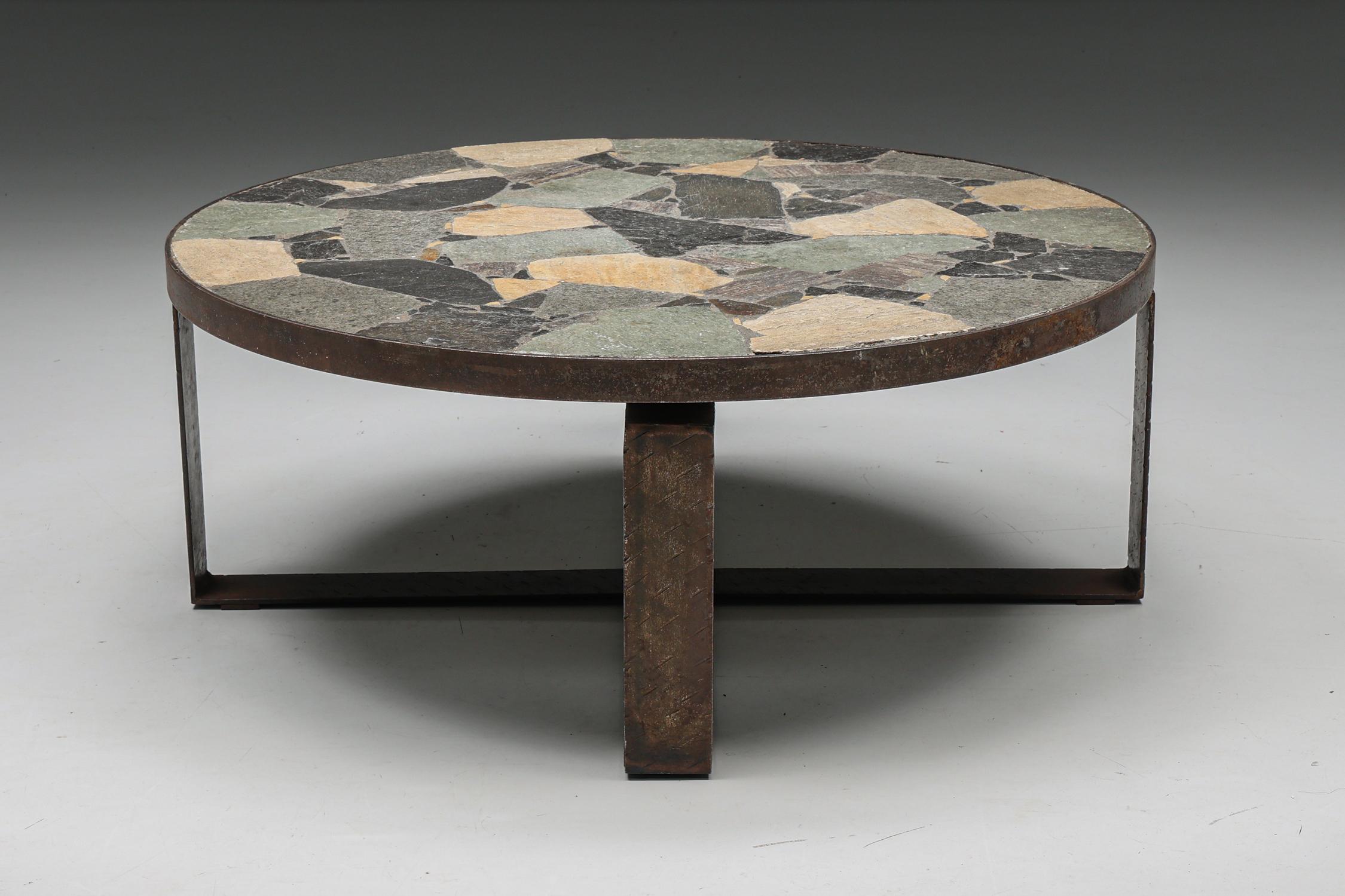 Italian design; Italy, Italian craftsmanship; Mosaic Stone Coffee Table; Iron; Mid-Century Modern; Italy; 1950's;

Italian coffee table with mosaic stone table top made in the 1950s. The round tabletop rests on an iron base and is lifted slightly